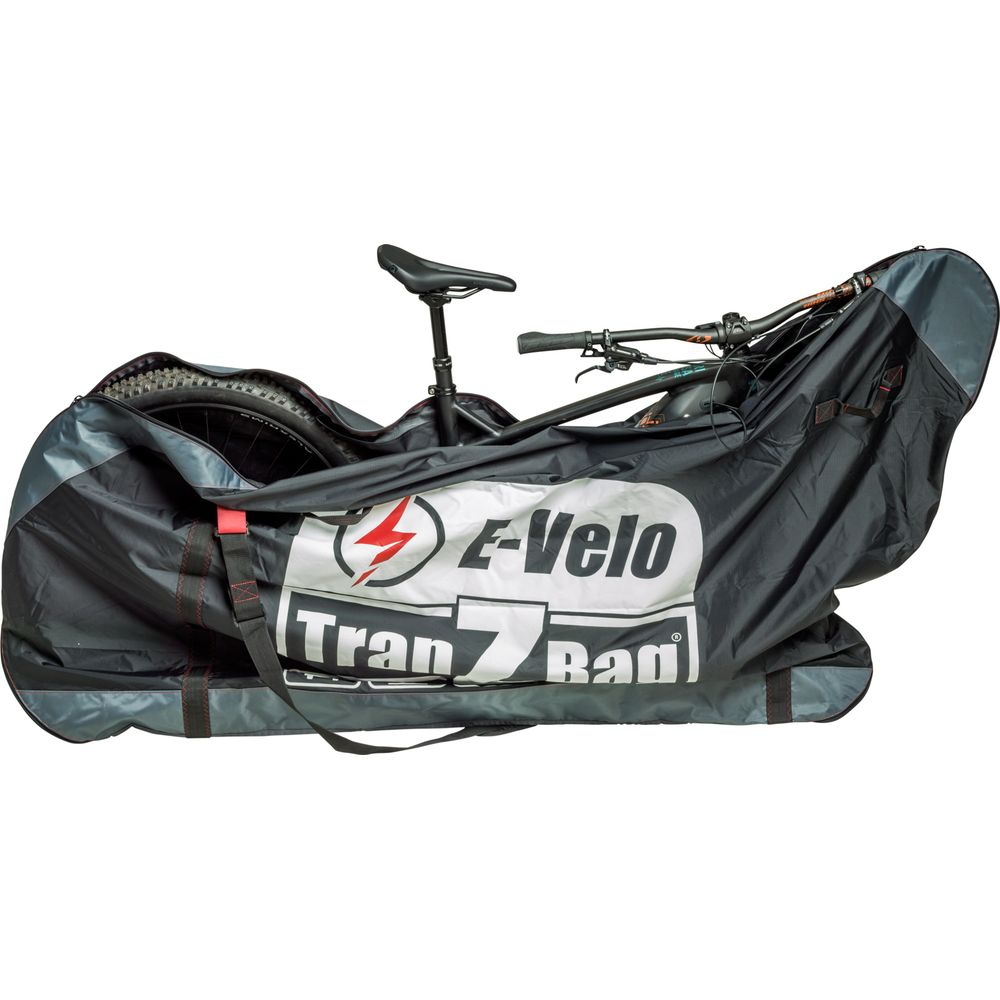 Un VTT dans un sac E-Velo Trans noir avec des accents rouges.