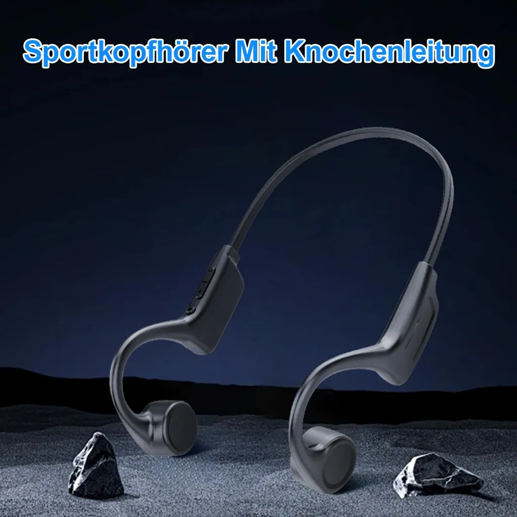 Schwarze Bone-Conduction-Kopfhörer liegen auf grauem Boden mit Steinen.