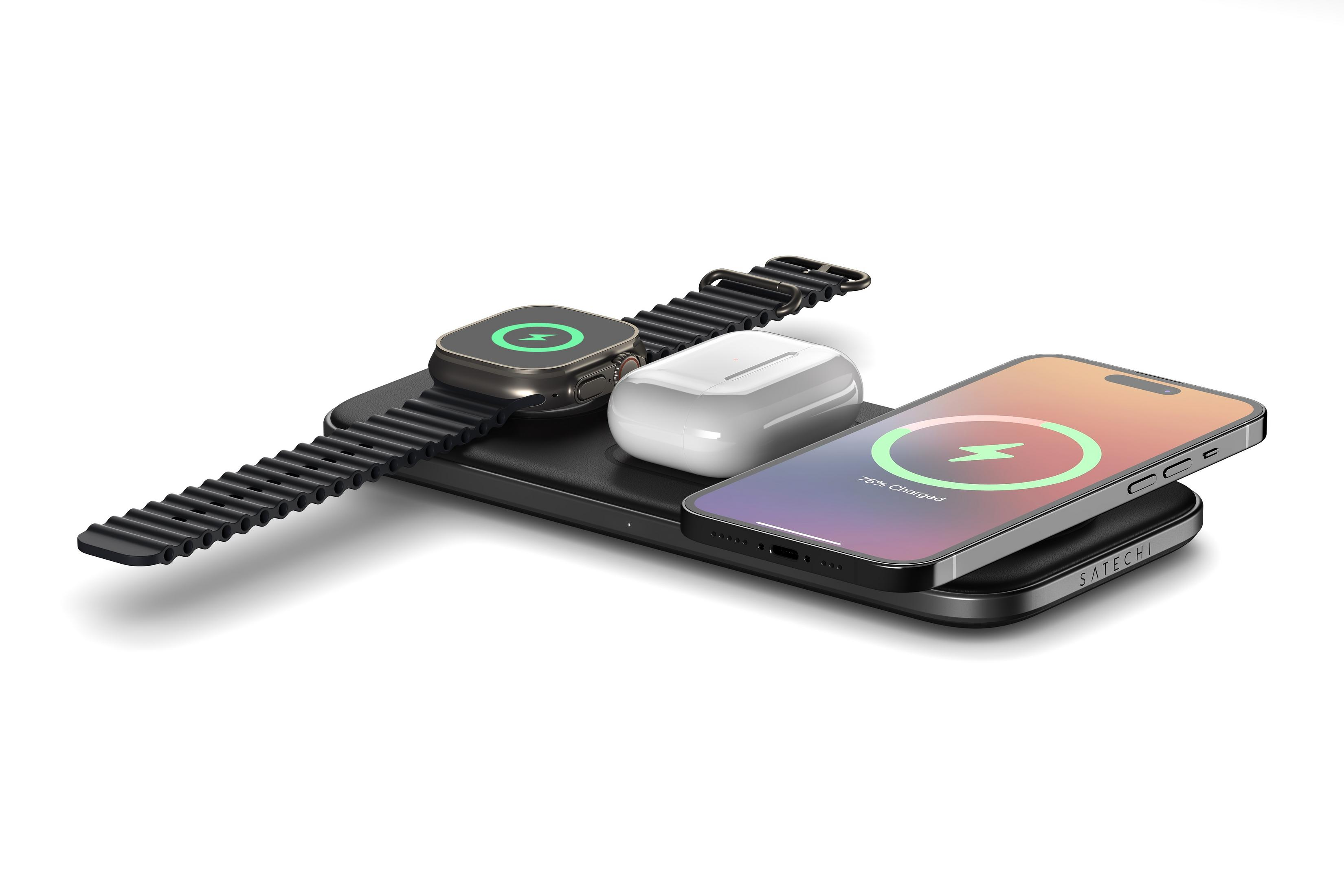 Ein schwarzes Ladegerät mit einer Smartwatch, Kopfhörern und einem Smartphone.