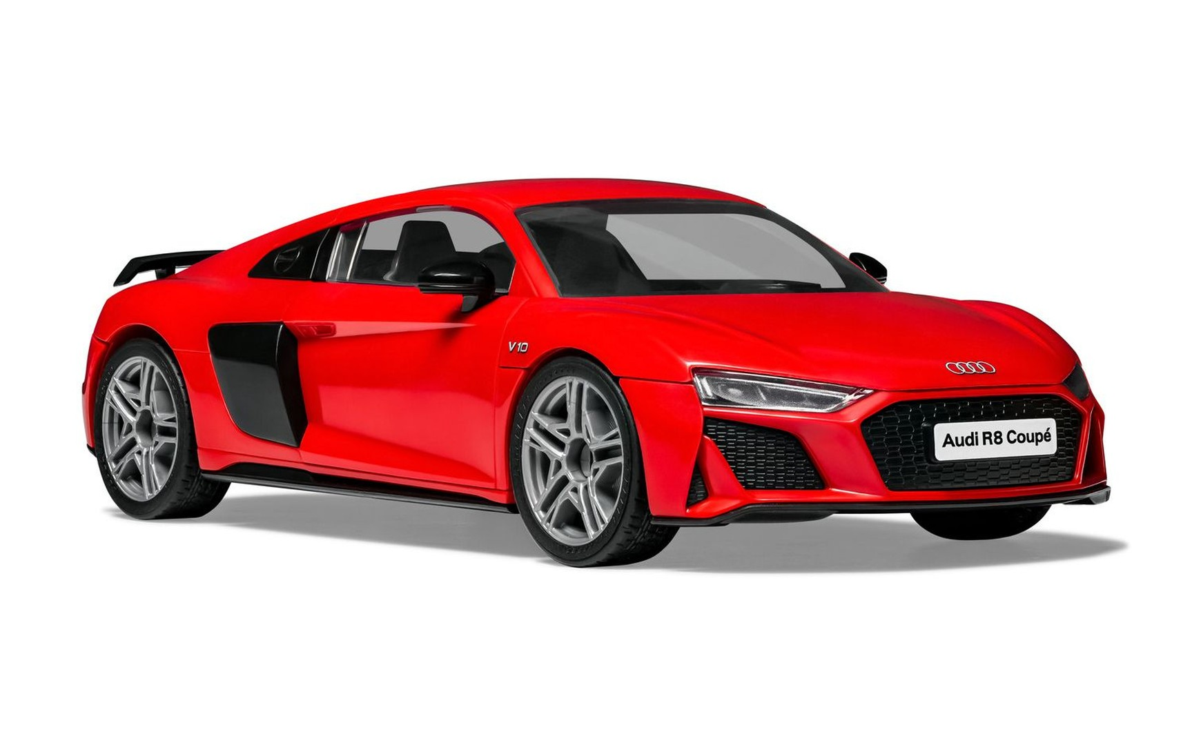 Ein roter Audi R8 Coupé mit V10-Emblem und silbernen Felgen.
