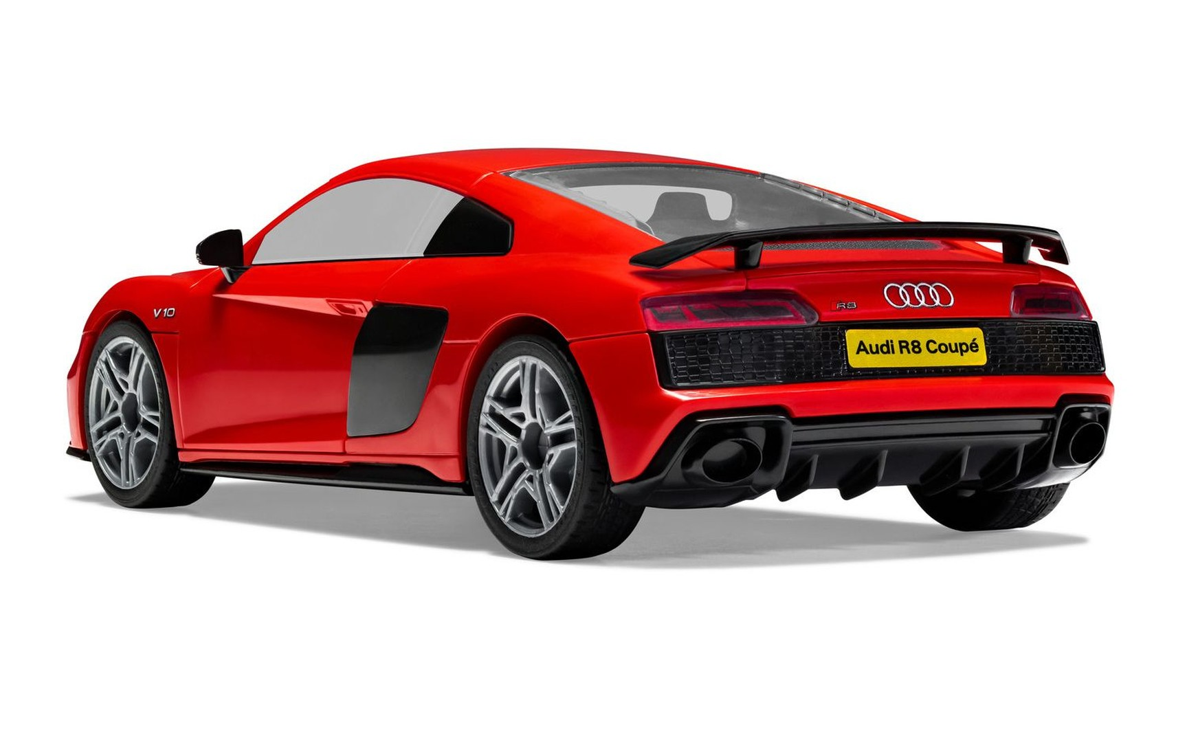 Roter Audi R8 Coupé mit schwarzem Spoiler und Auspuff.