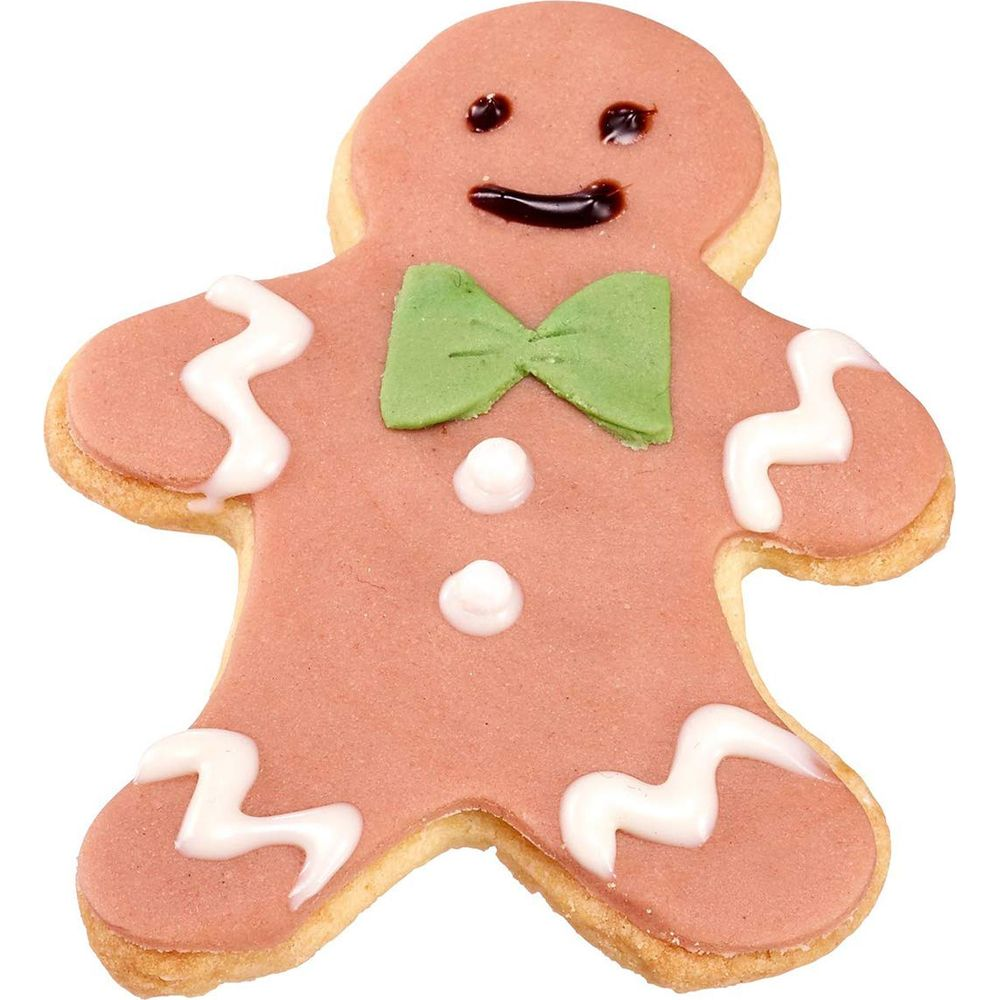 Un biscuit bonhomme en pain d'épice avec glaçage rose, nœud papillon vert et détails blancs.