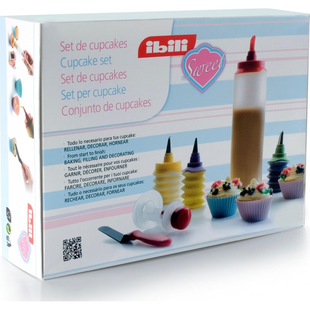 Boîte d'outils pour décorer des cupcakes : bouteilles, douilles et cupcakes décorés.