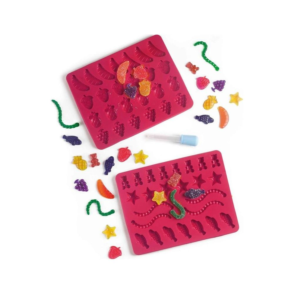 Deux moules roses à gommes avec des bonbons gélifiés colorés en forme d'animaux.