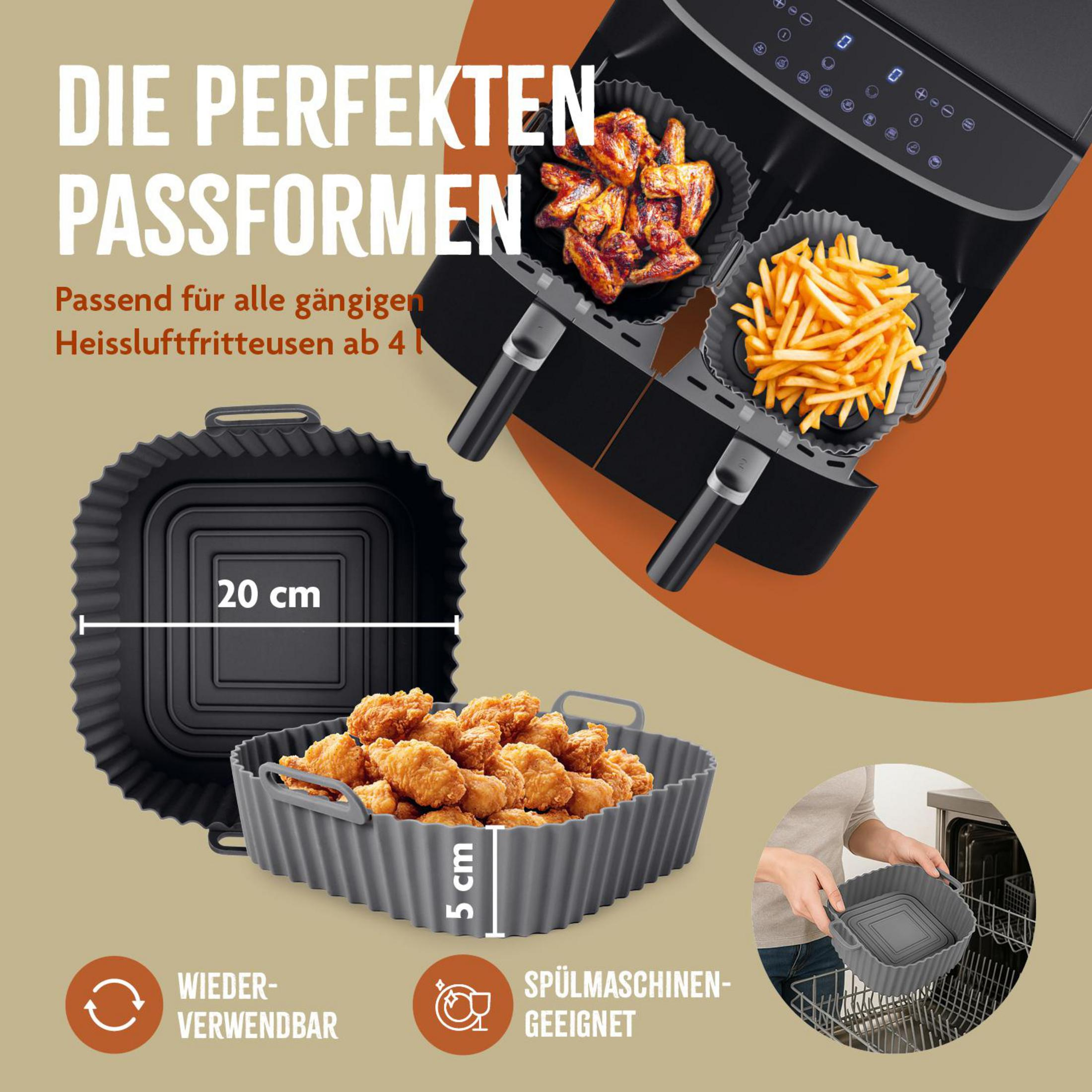 Air fryer mit Silikoneinsätzen, gefüllt mit Hähnchen und Pommes.