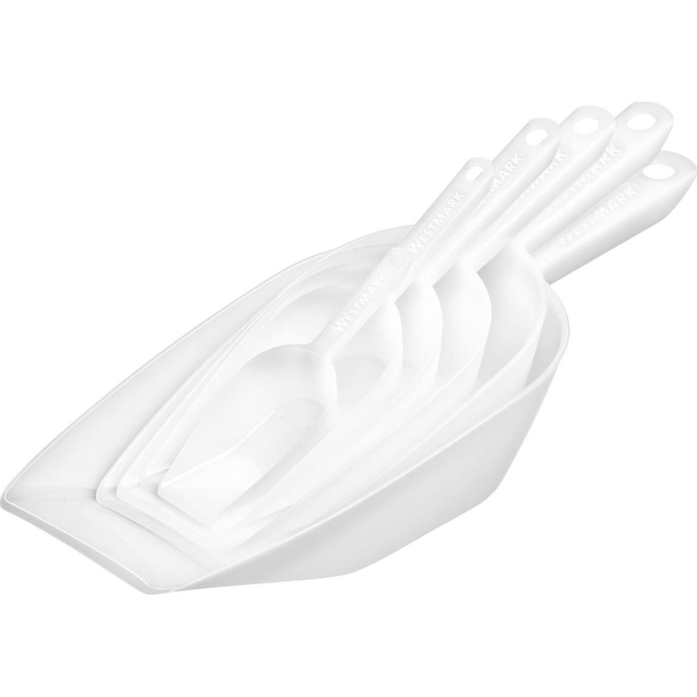 Quattro palette di plastica bianche di varie dimensioni, incastrate.