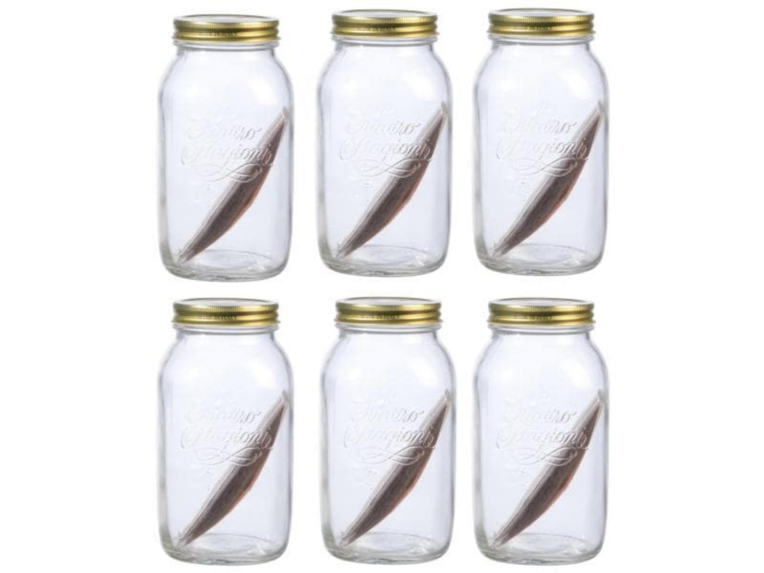 Six bocaux en verre avec couvercles dorés, chacun contenant un objet marron.