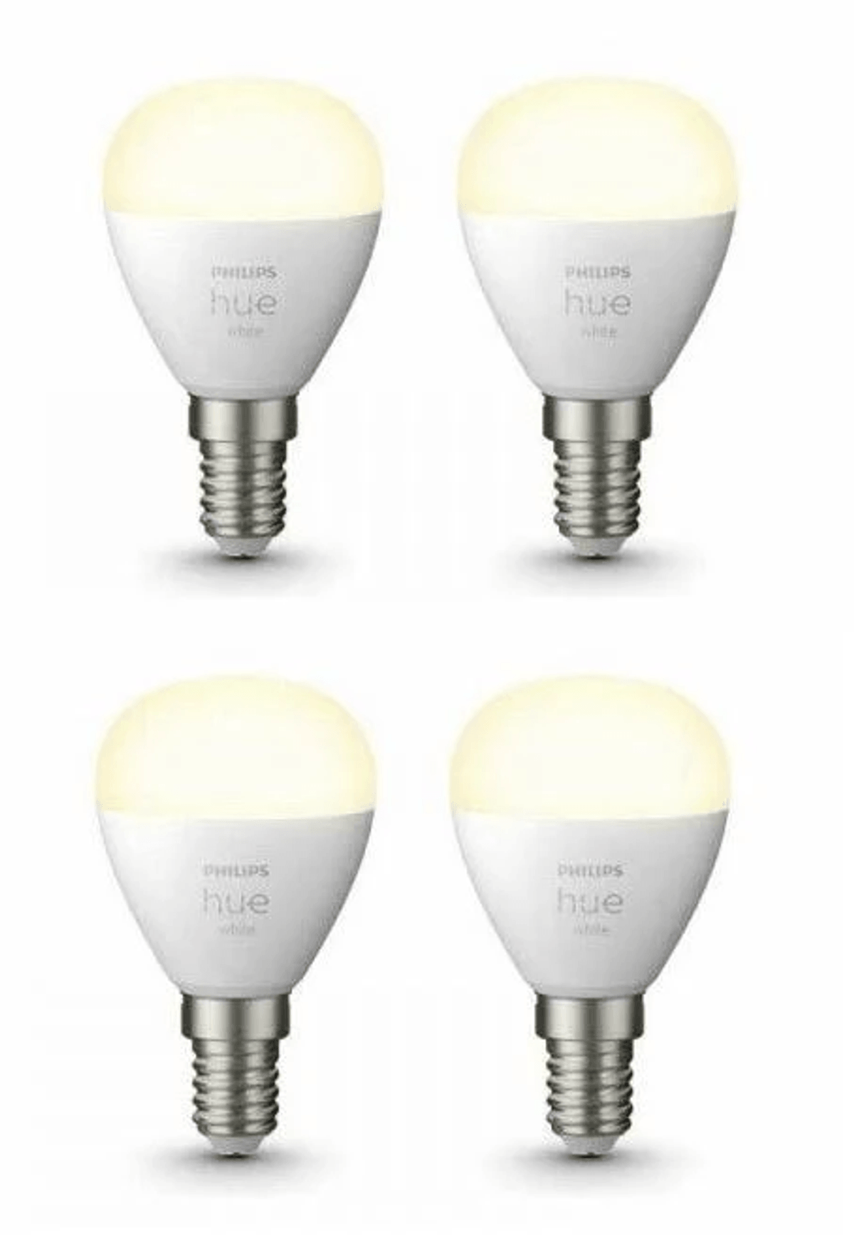 Vier weiße Philips Hue Glühbirnen mit E14-Sockel auf weißem Hintergrund.