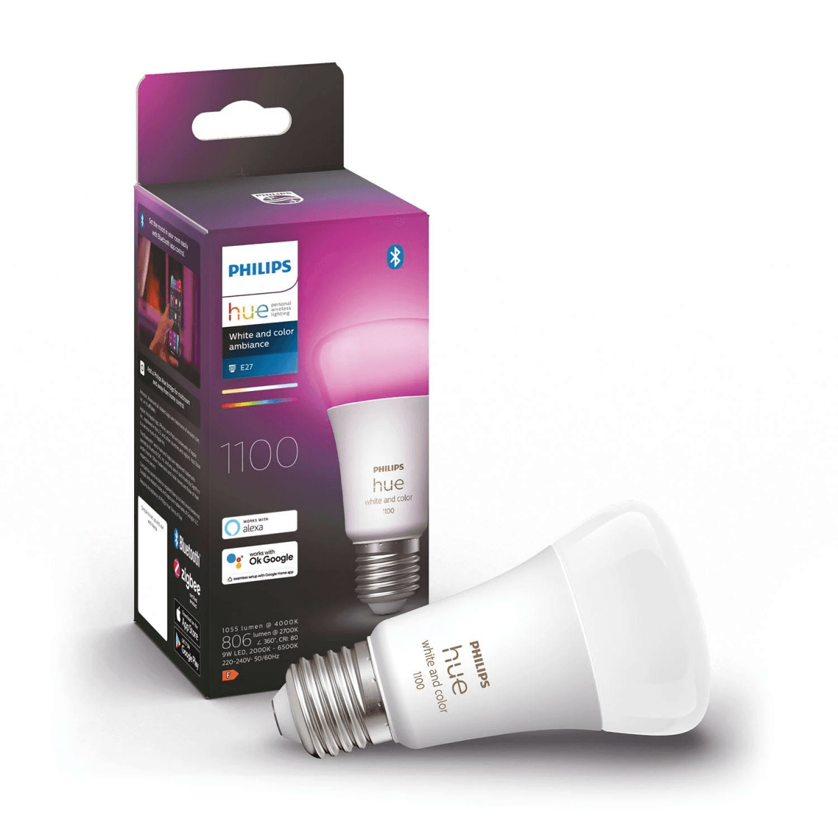 Ein Philips Hue White and Color Smart Bulb liegt neben seiner Verpackung.