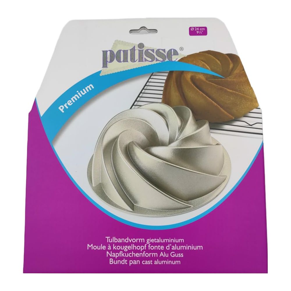 Forma Bundt Patisse z odlewanego aluminium, 24cm, z upieczonym ciastem na ruszcie.