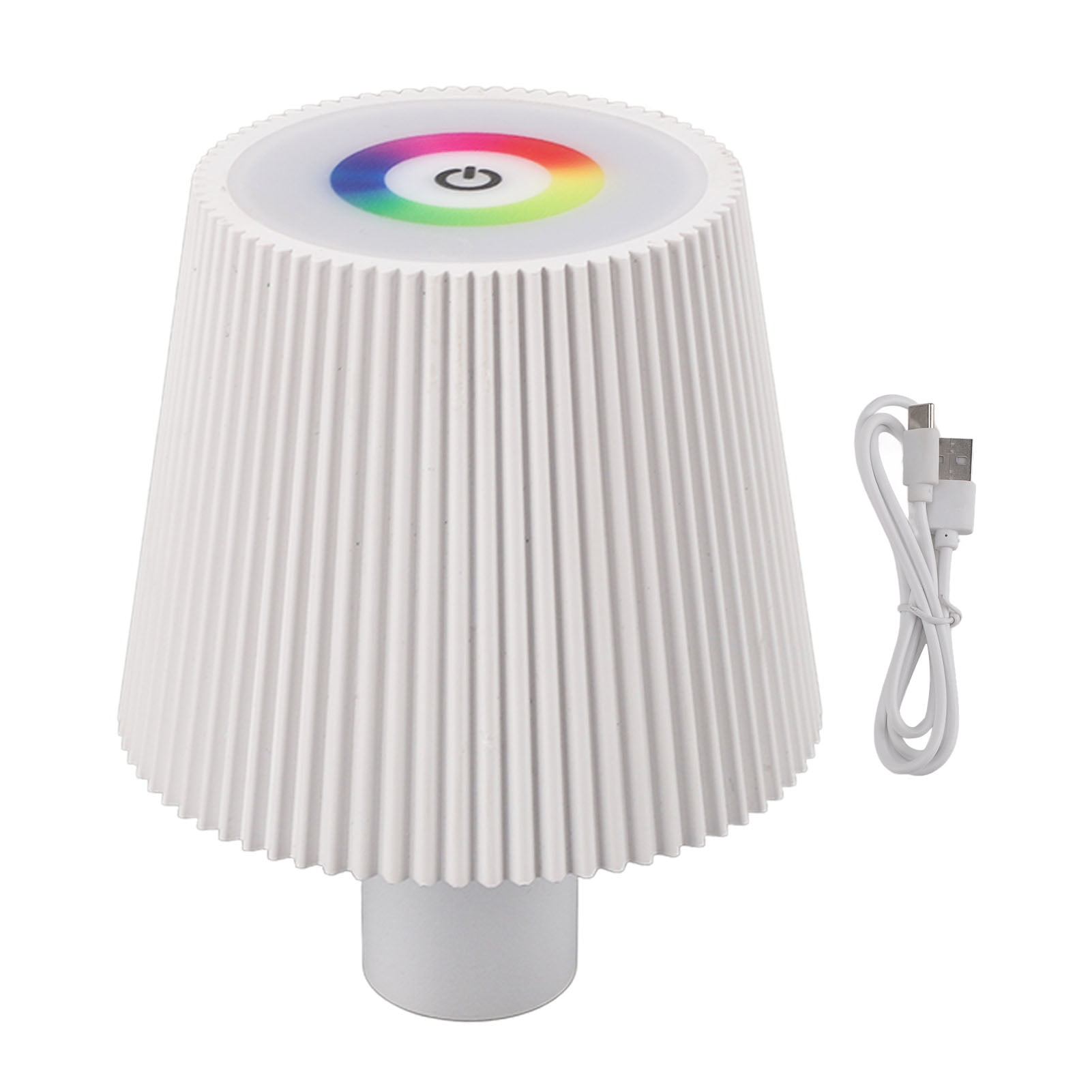 Eine weiße Lampe mit geripptem Schirm und farbigem Lichtkreis oben.