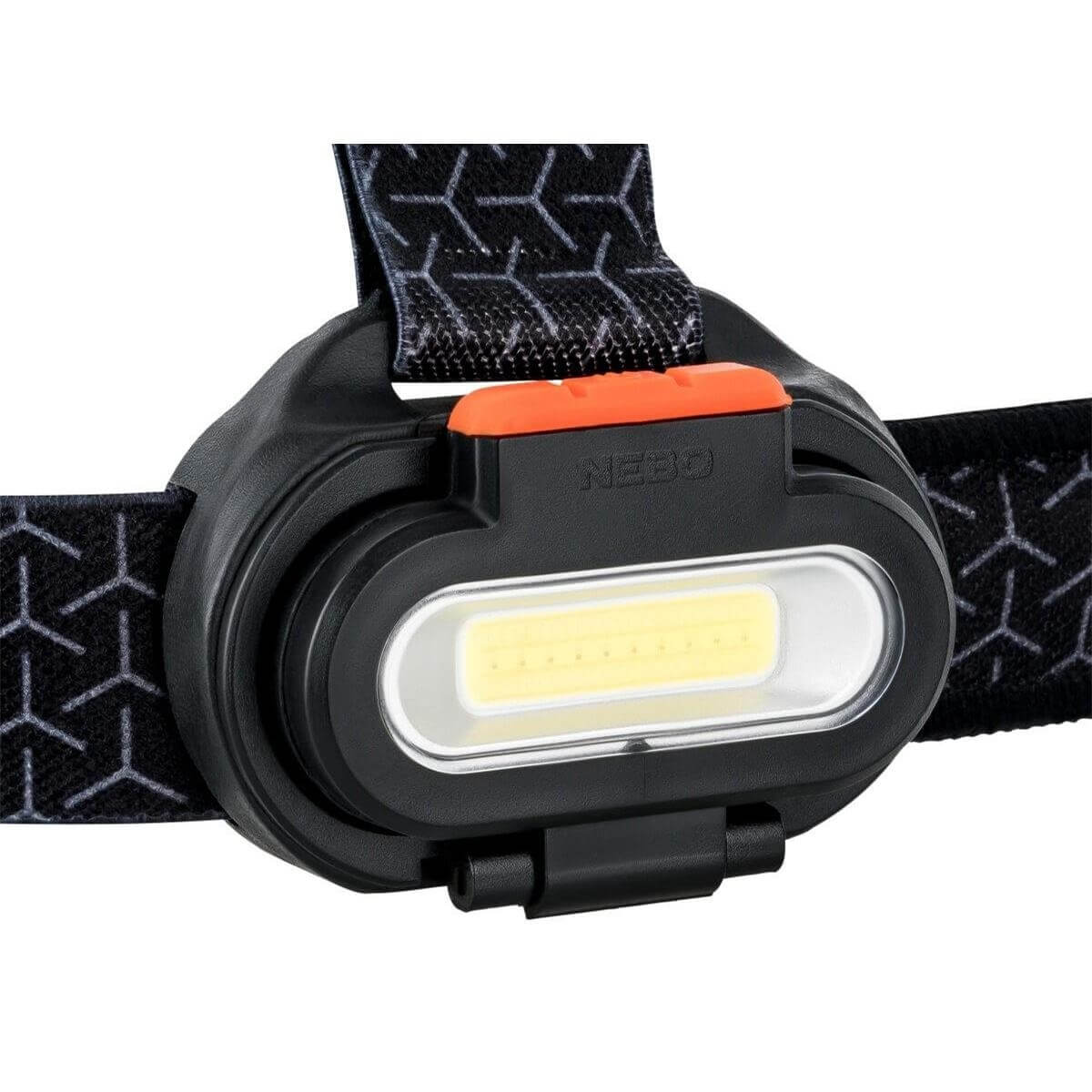 Une lampe frontale noire avec une LED lumineuse et un interrupteur orange.