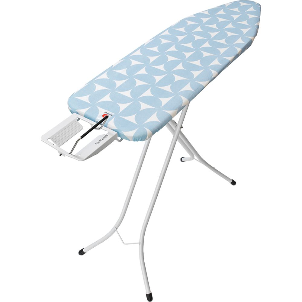 A white ironing board with a blue and white pattern and metal legs.