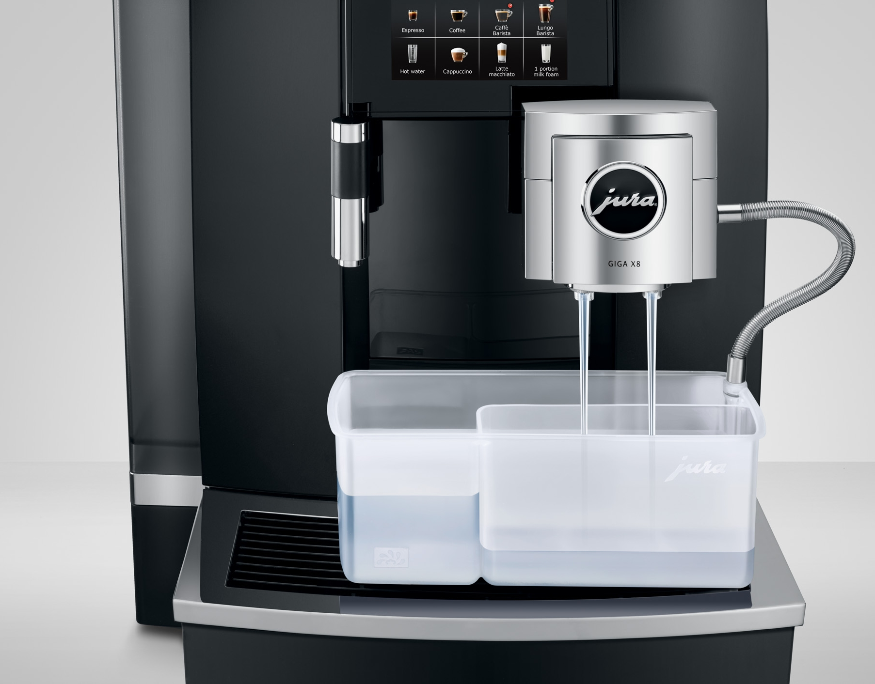 Una macchina da caffè nera con accenti argentati che eroga caffè.