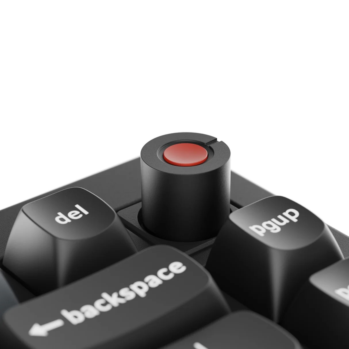 Zbliżenie czarnej klawiatury z czerwonym przyciskiem i klawiszami.