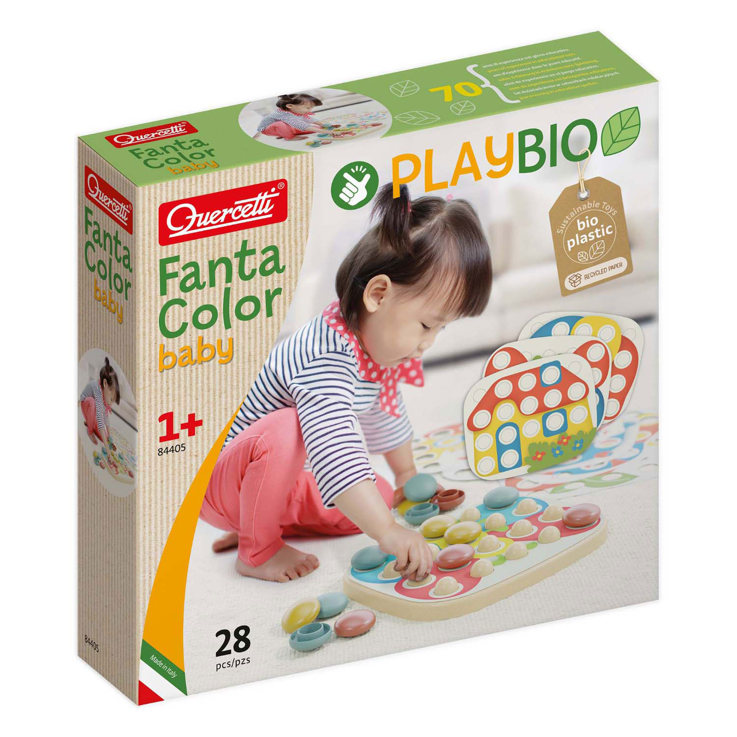 Baby spielt mit bunten Steckern auf einem Spielbrett. Packung von Quercetti Fanta Color.