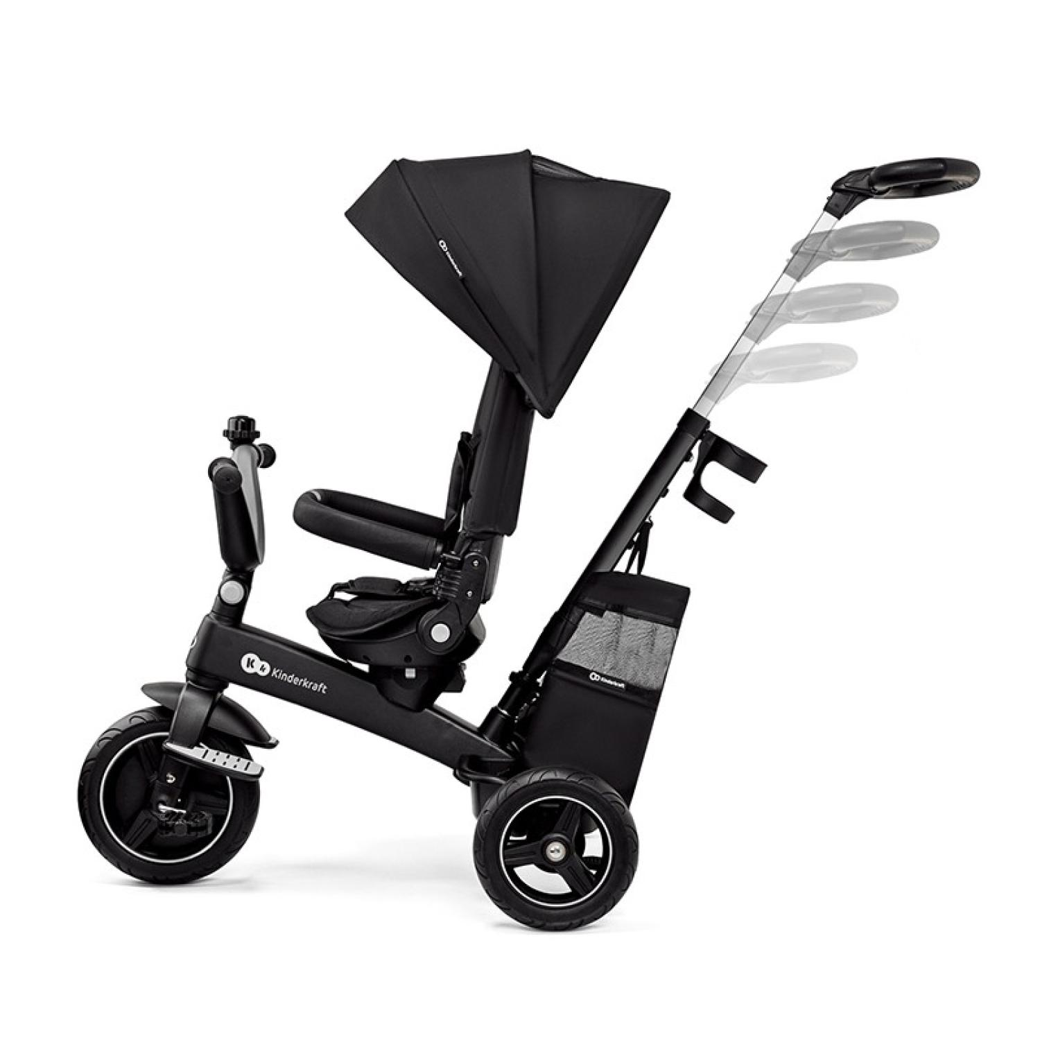 Ein schwarzer Kinderdreirad mit Verdeck, Sitz und Tasche.