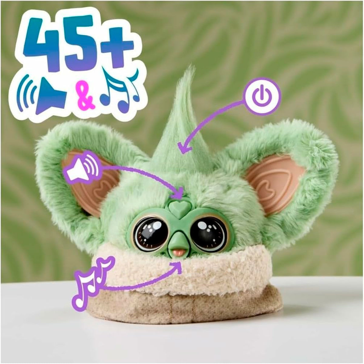 Personaje de peluche verde con ojos grandes, orejas e íconos de sonido.