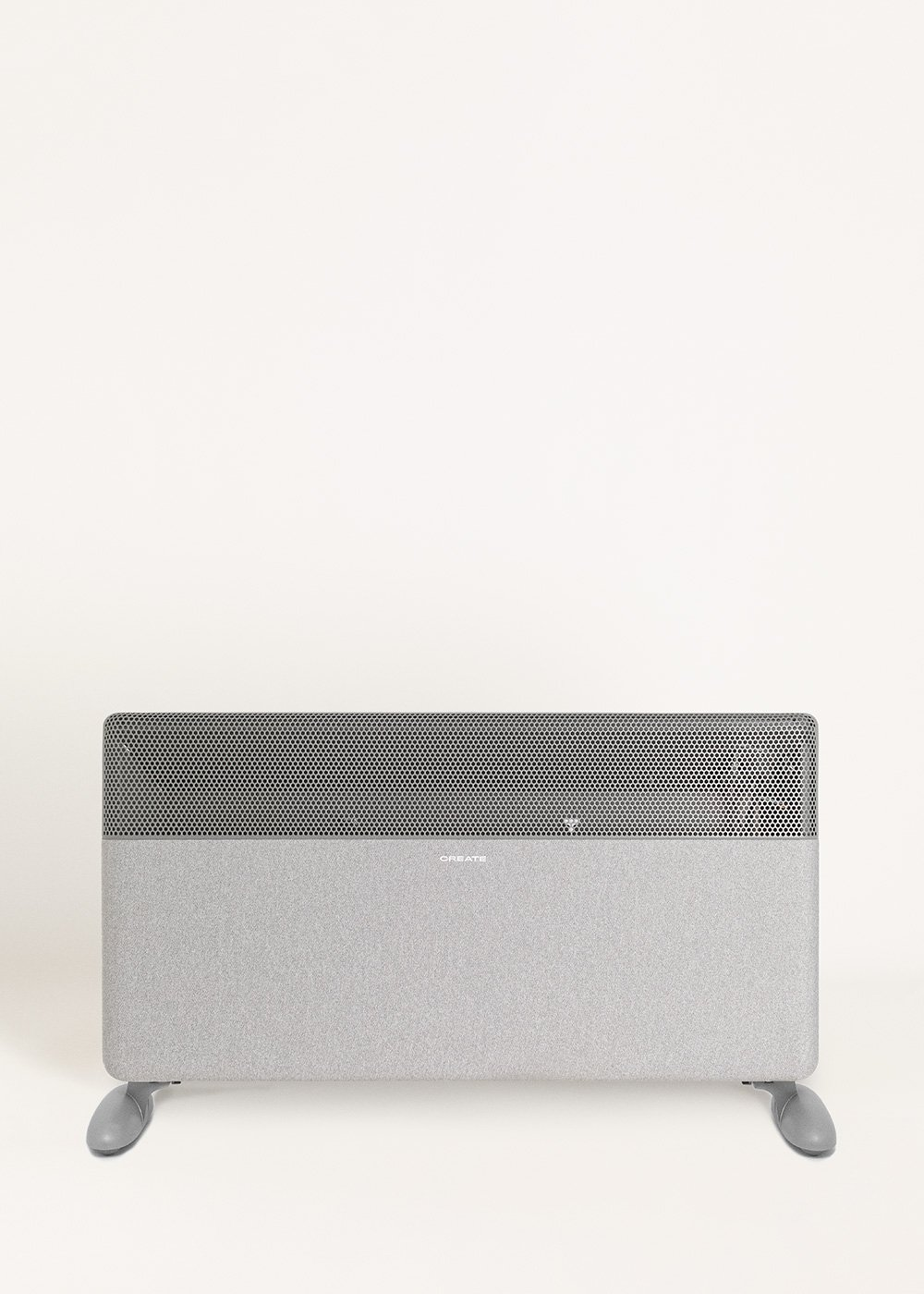 Un radiador gris con rejilla de ventilación y dos pies.