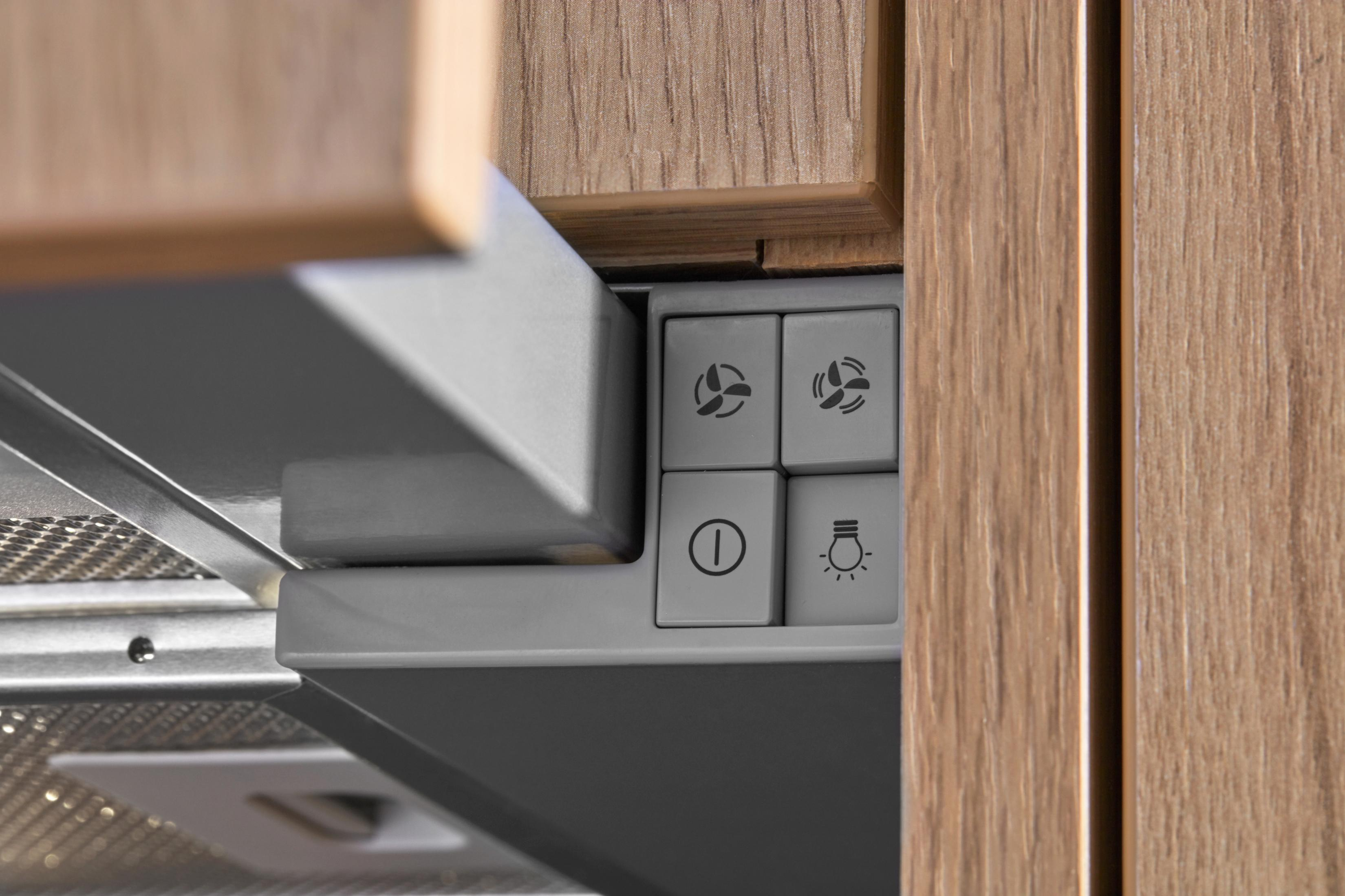 Controles de campana extractora: botones de ventilador y luz.