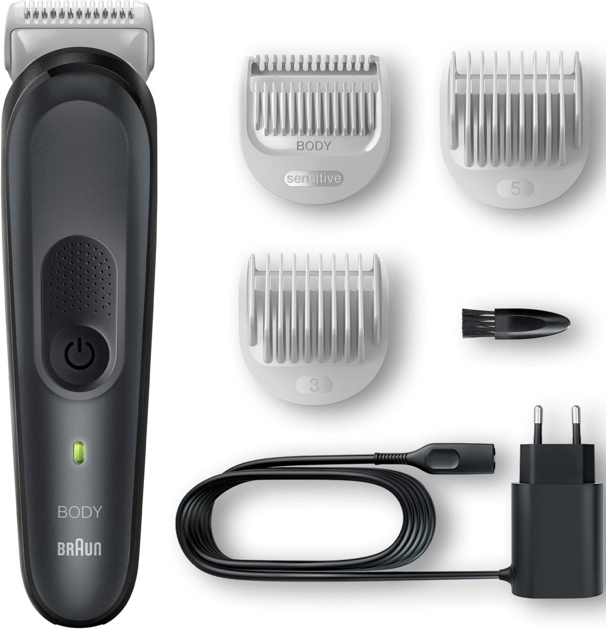 Ein dunkler Trimmer mit Zubehör: Aufsätze, Bürste, Kabel und Ladegerät.