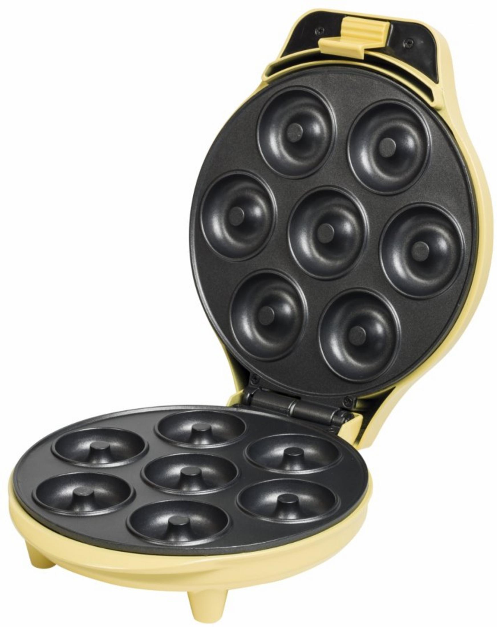 Eine gelbe Donutmaschine mit geöffnetem Deckel, die sieben Mulden zeigt.