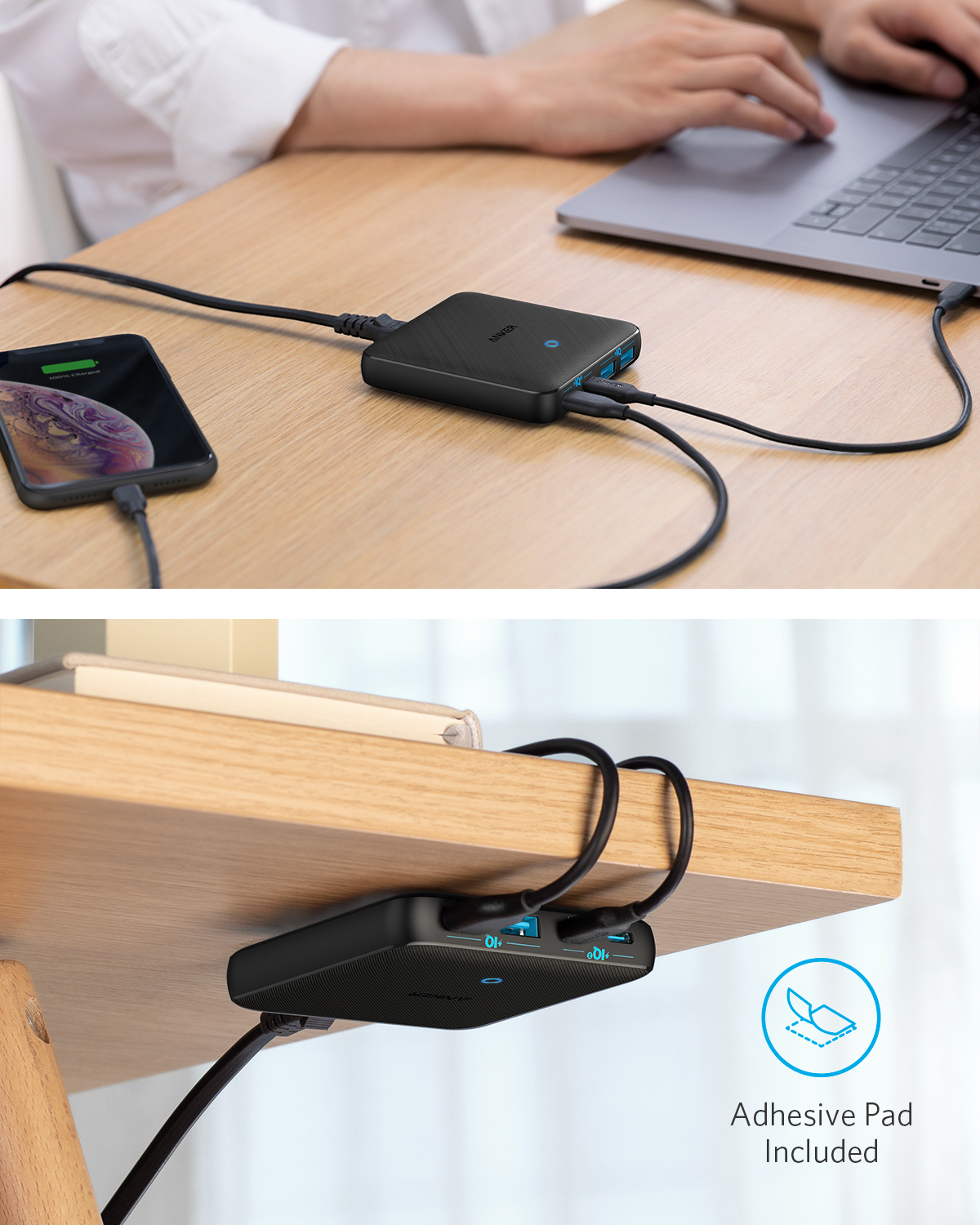 Ein schwarzes Ladegerät lädt ein Smartphone und einen Laptop an einem Holztisch.