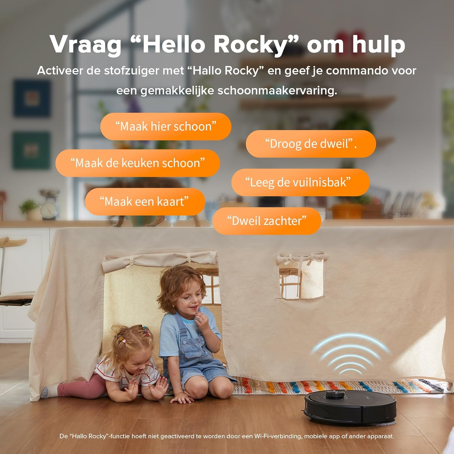 A robot vacuum cleaner is in front of a homemade tent with children playing inside.
