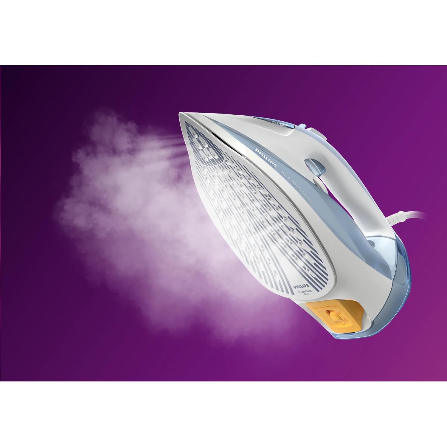 A white and blue Philips iron emitting steam against a purple background.