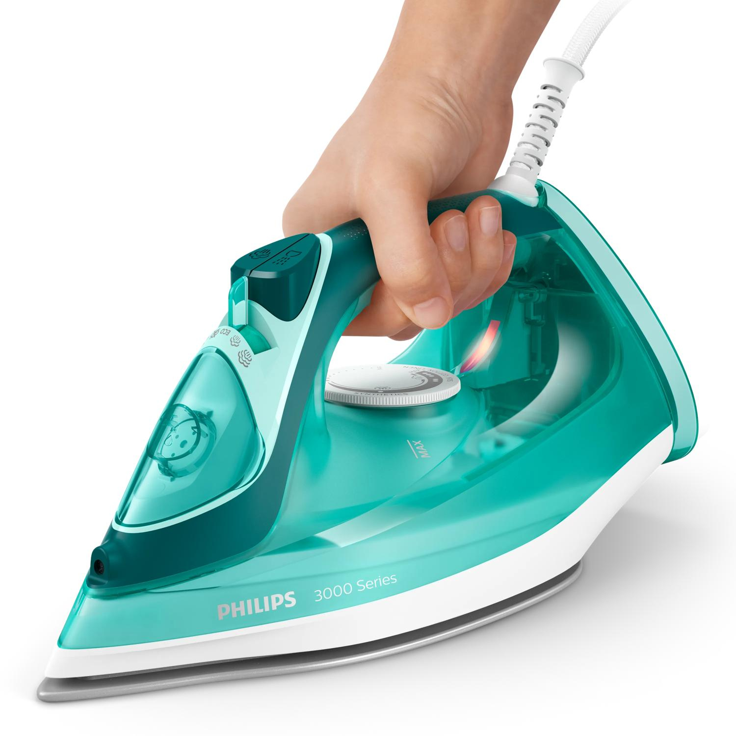 Dłoń trzymająca turkusowe żelazko parowe Philips 3000 Series z białym kablem.