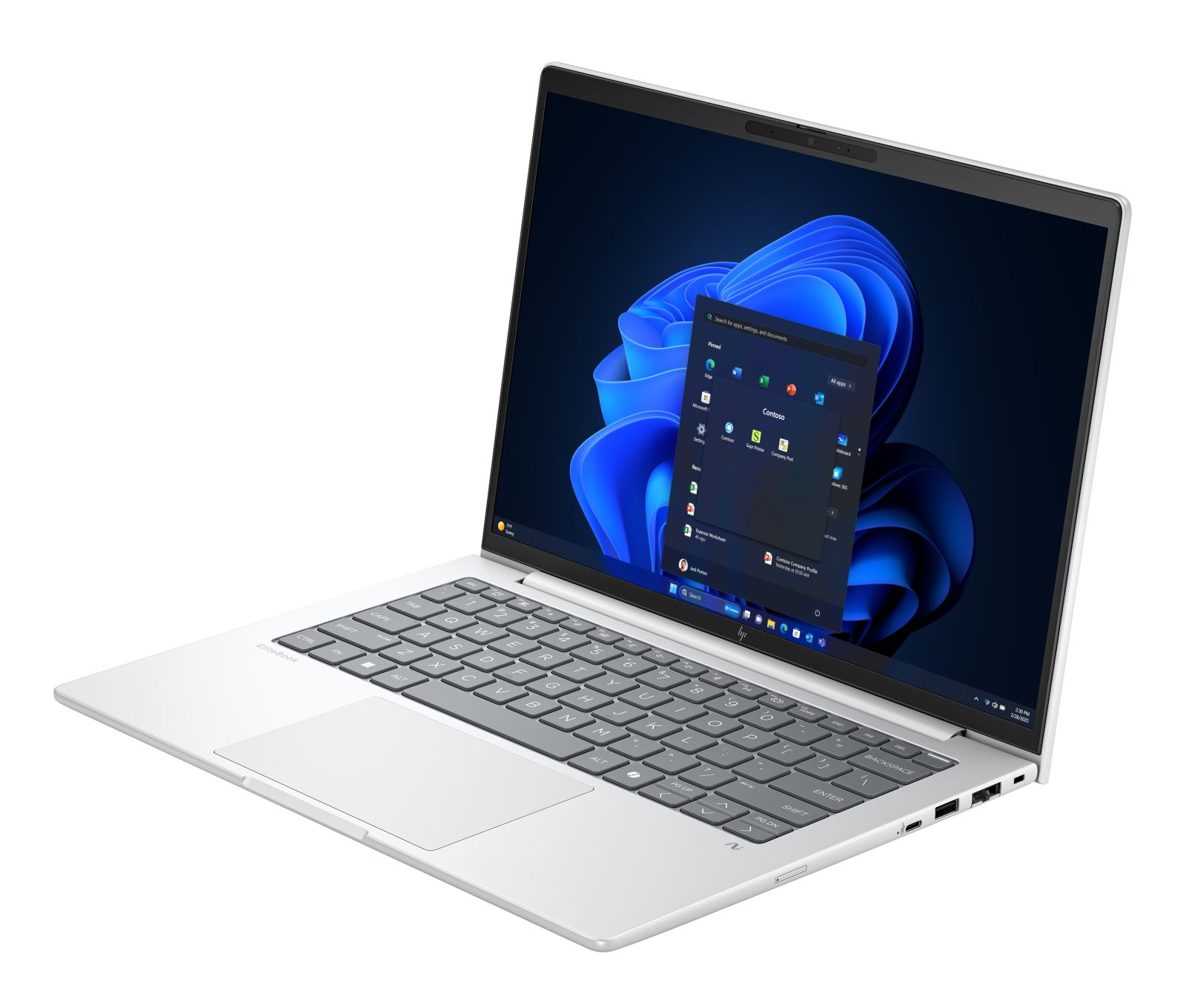 Otwarty srebrny laptop z niebieskim menu startowym Windows 11 na ekranie.