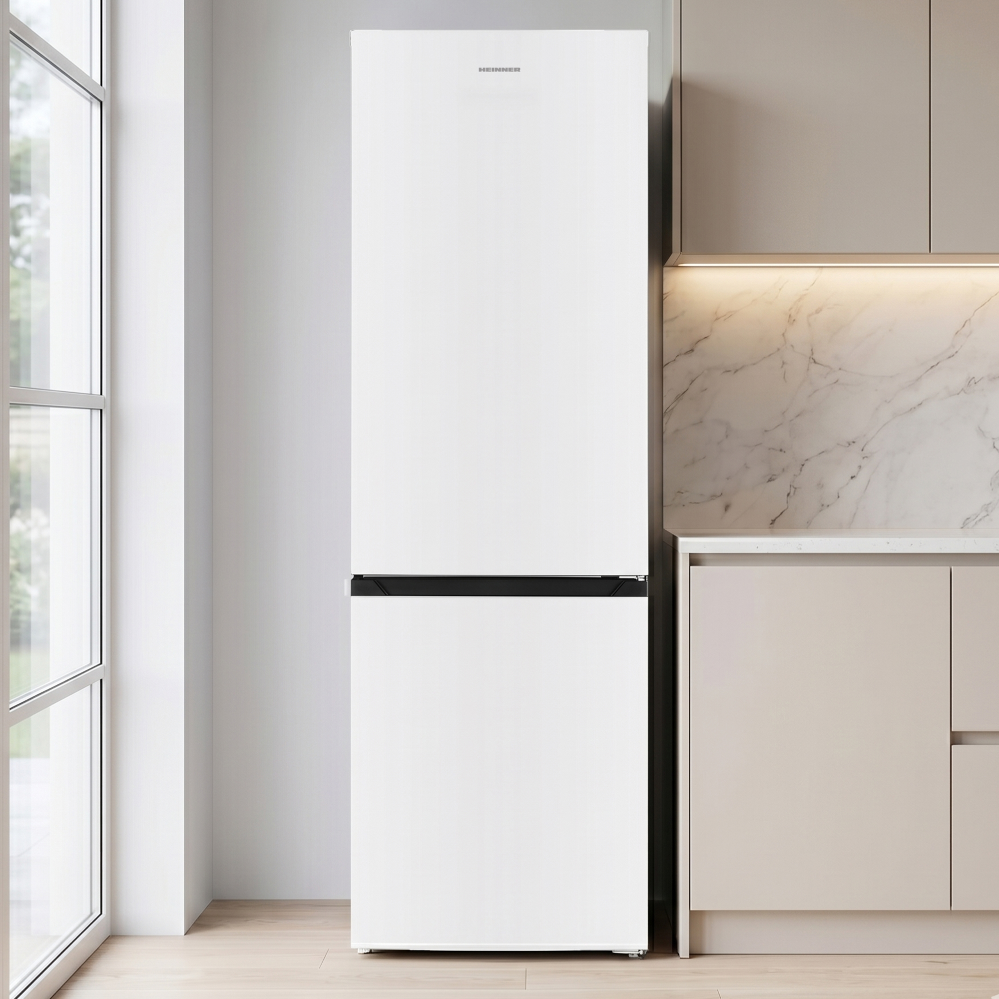 A white refrigerator stands next to a kitchen counter with light brown cabinets and marble backsplash.