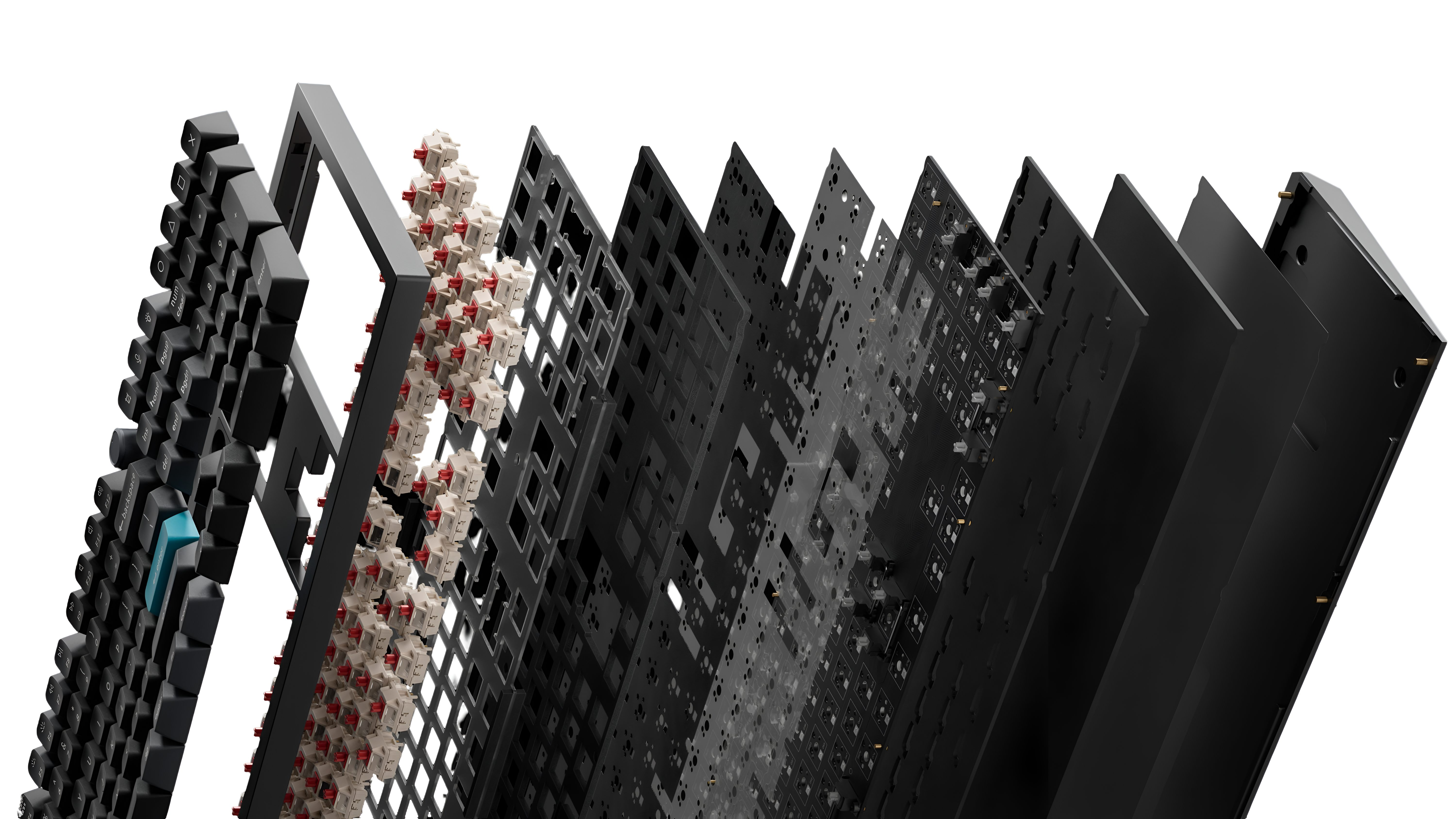 Widok rozstrzelony klawiatury pokazujący nakładki klawiszy, przełączniki, płytkę drukowaną i warstwy obudowy.