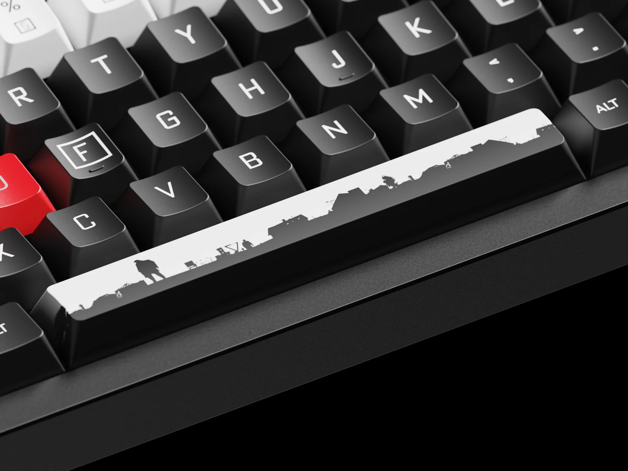 Zbliżenie czarnej klawiatury z białym klawiszem przedstawiającym czarną sylwetkę panoramy miasta.