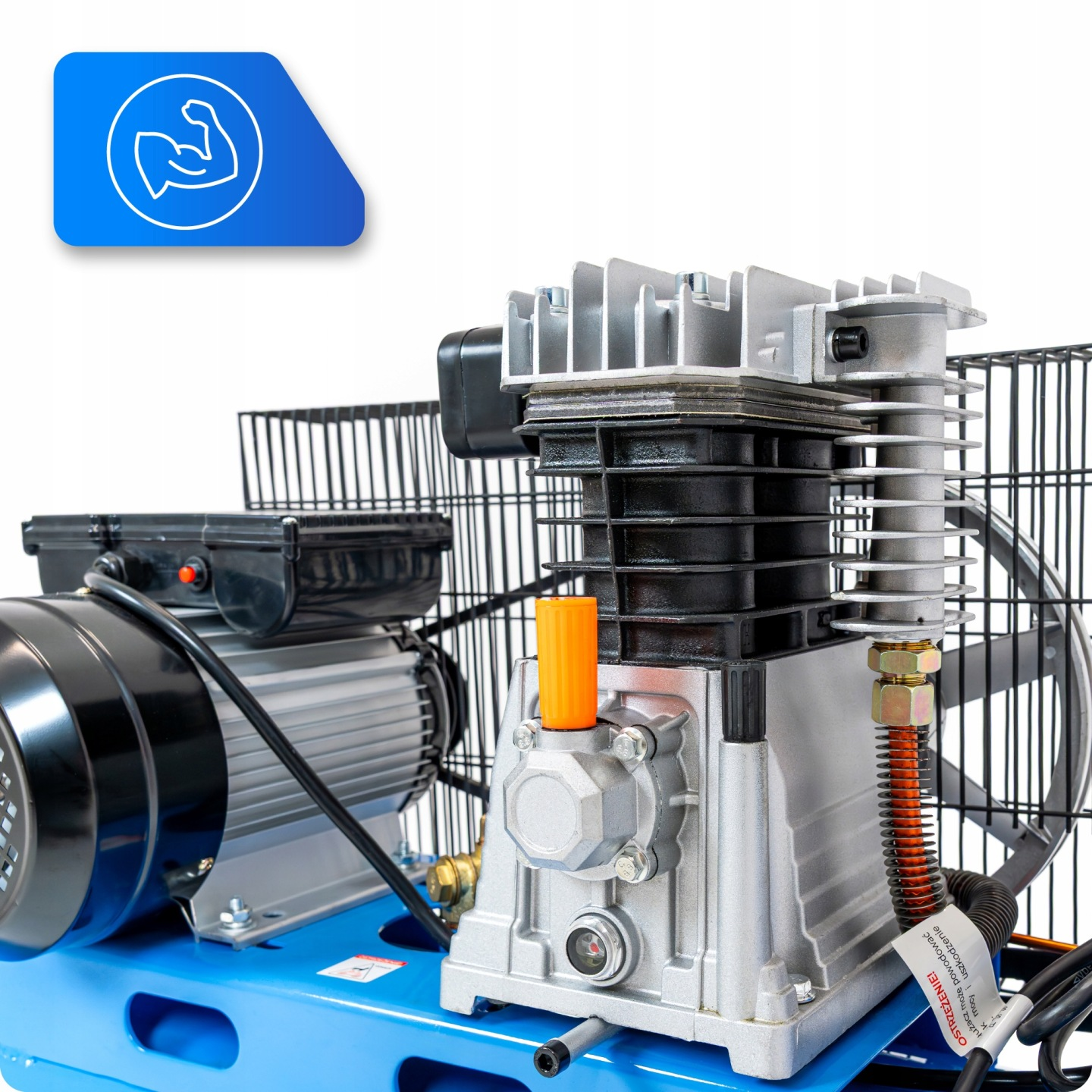 Srebrno-czarny kompresor na niebieskiej podstawie z ikoną siły.