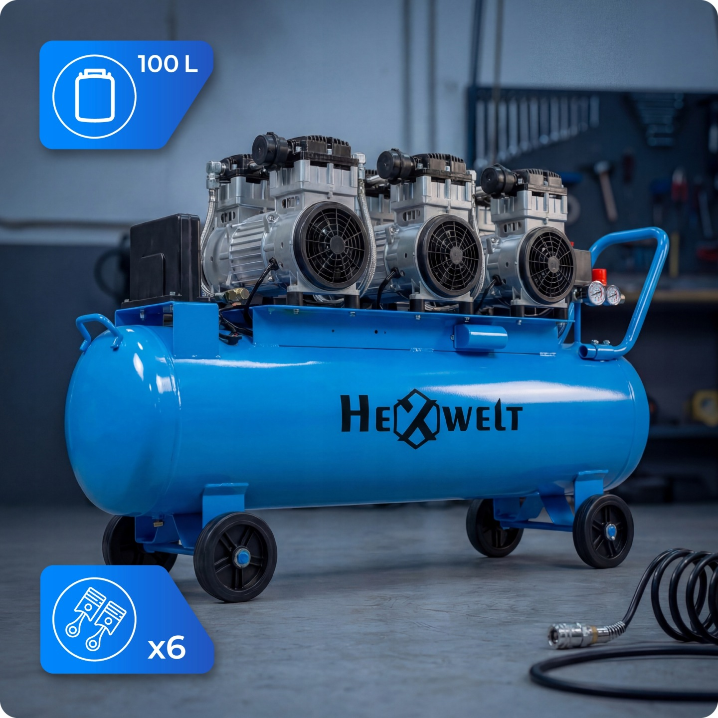 Niebieski kompresor powietrza 100L z trzema silnikami i kołami stoi w warsztacie.