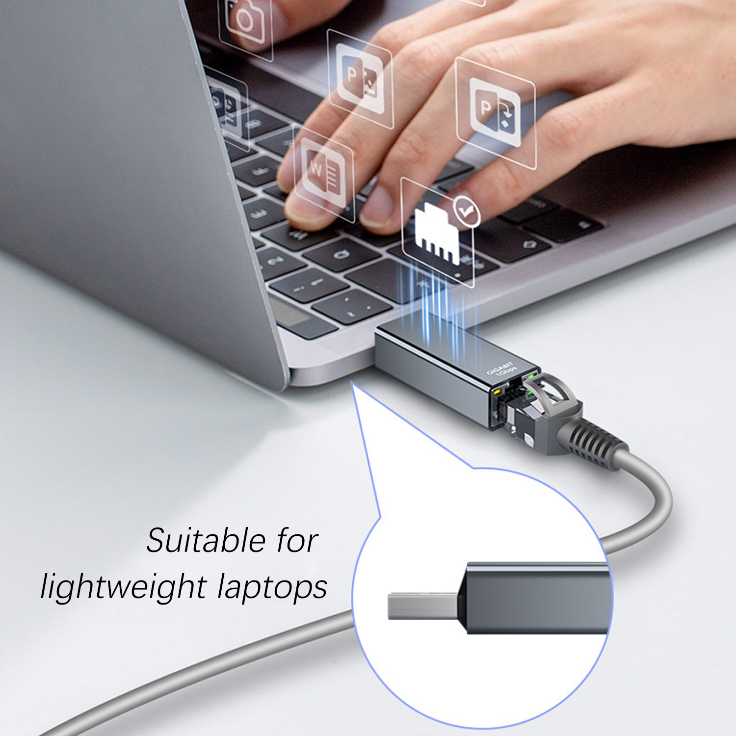 Person tippt auf Laptop; USB-C-Ethernet-Adapter angeschlossen.