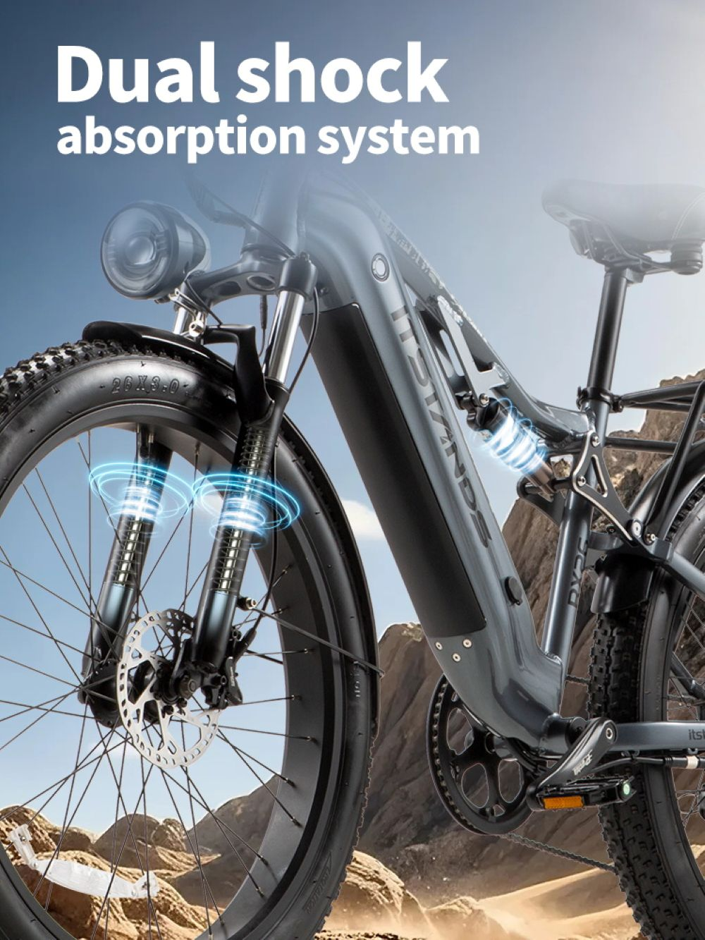 Bici elettrica grigia con sistema di doppio ammortizzatore, sospensioni anteriori e posteriori.