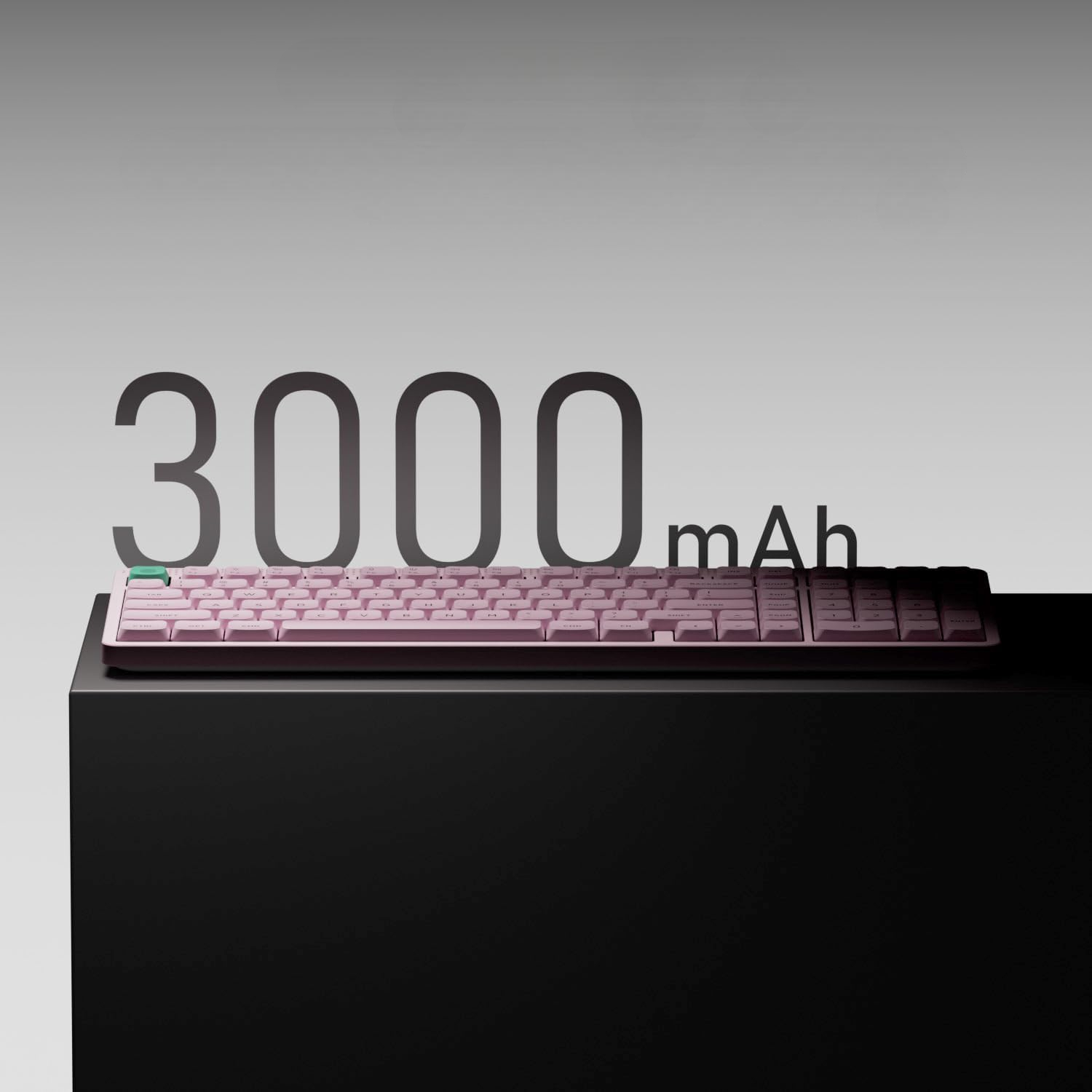 Różowa klawiatura 3000 mAh na czarnym bloku.