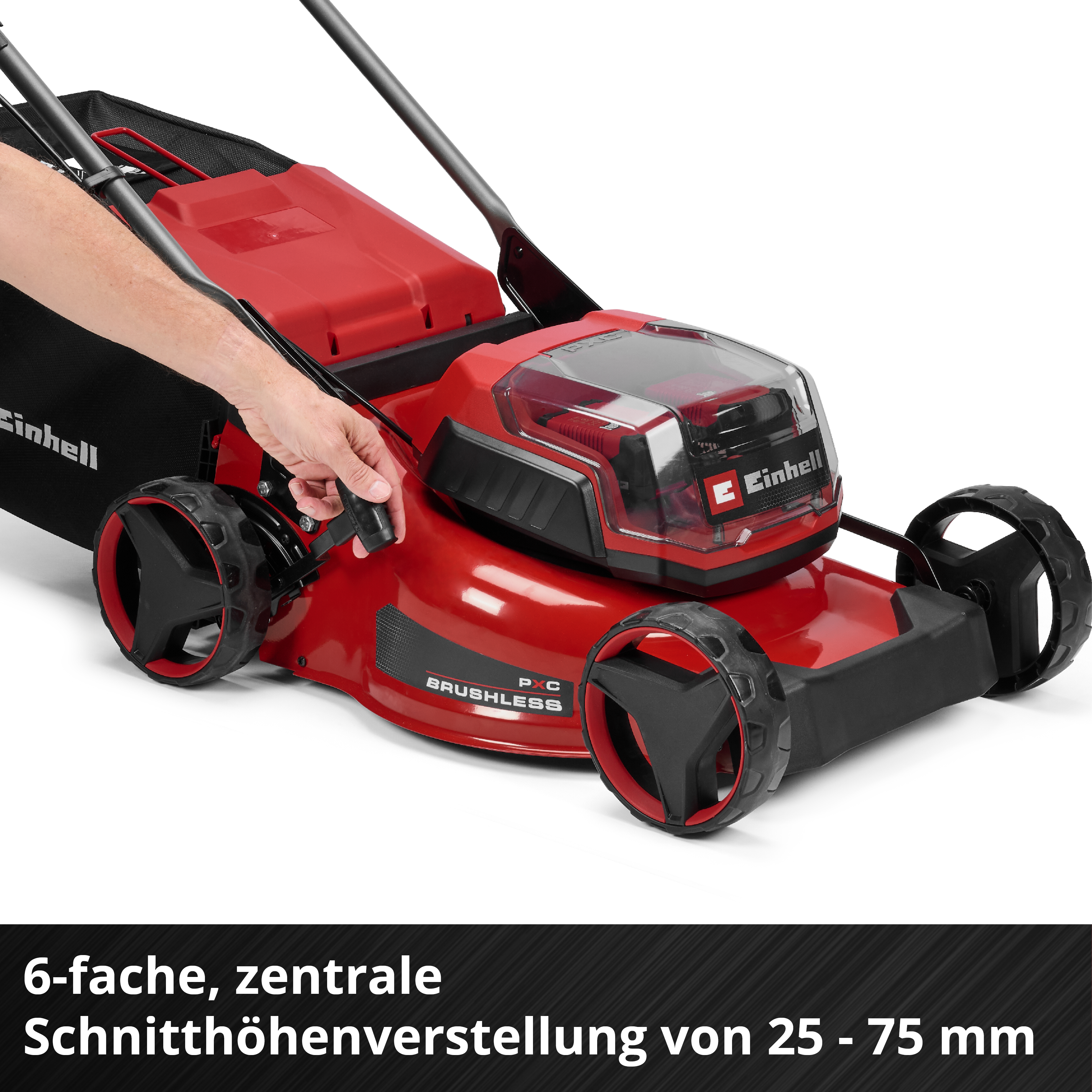Rote Gartenfräse mit schwarzem Fangkorb und einem Mann, der sie bedient.