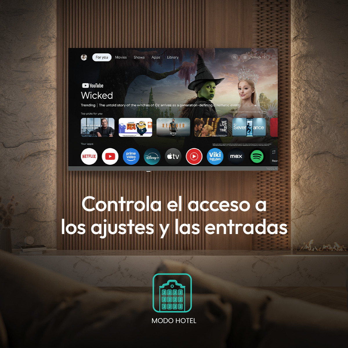 Una pantalla de TV muestra la interfaz de Google TV con la vista previa de 'Wicked' e iconos de apps.