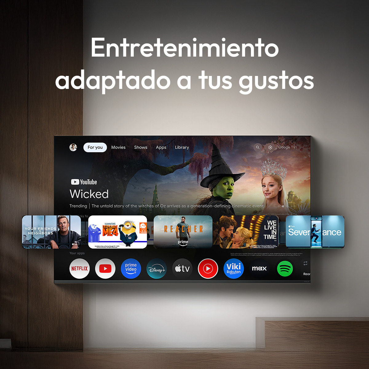 Pantalla de Smart TV con interfaz de Google TV, trailers y aplicaciones.