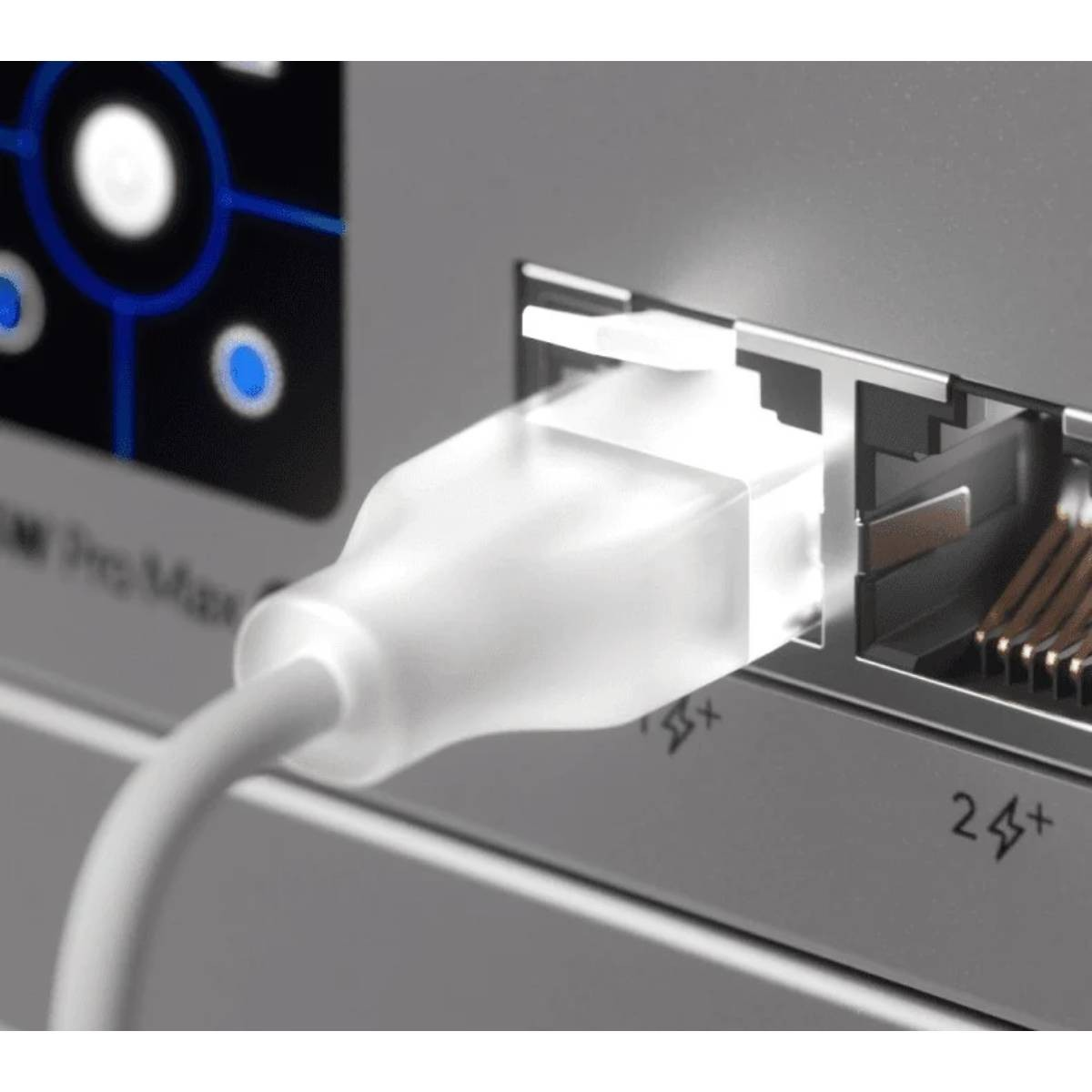 A white Ethernet plug is inserted into a port. Blue lights are visible.