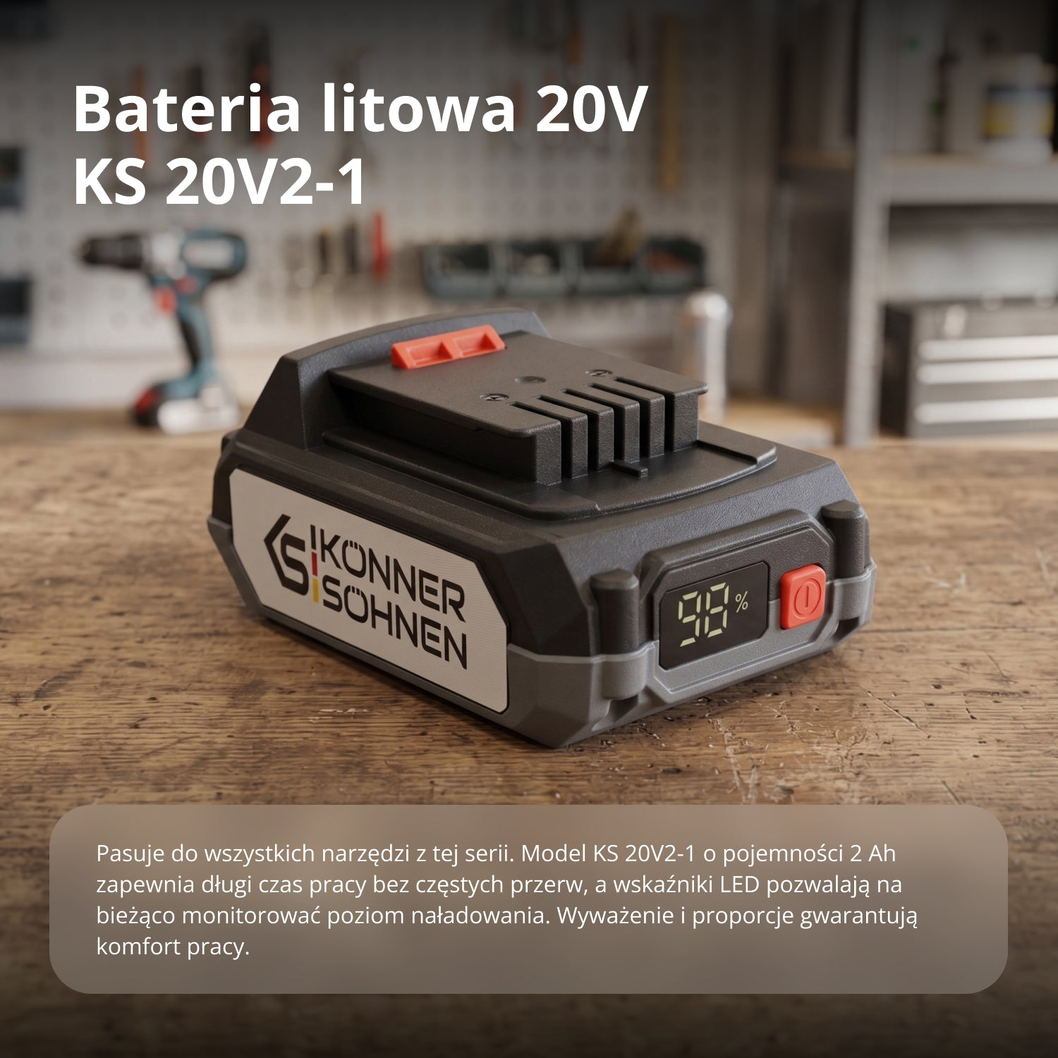 Bateria litowa 20V KS 20V2-1 pokazująca 98% naładowania, na drewnianym stole.