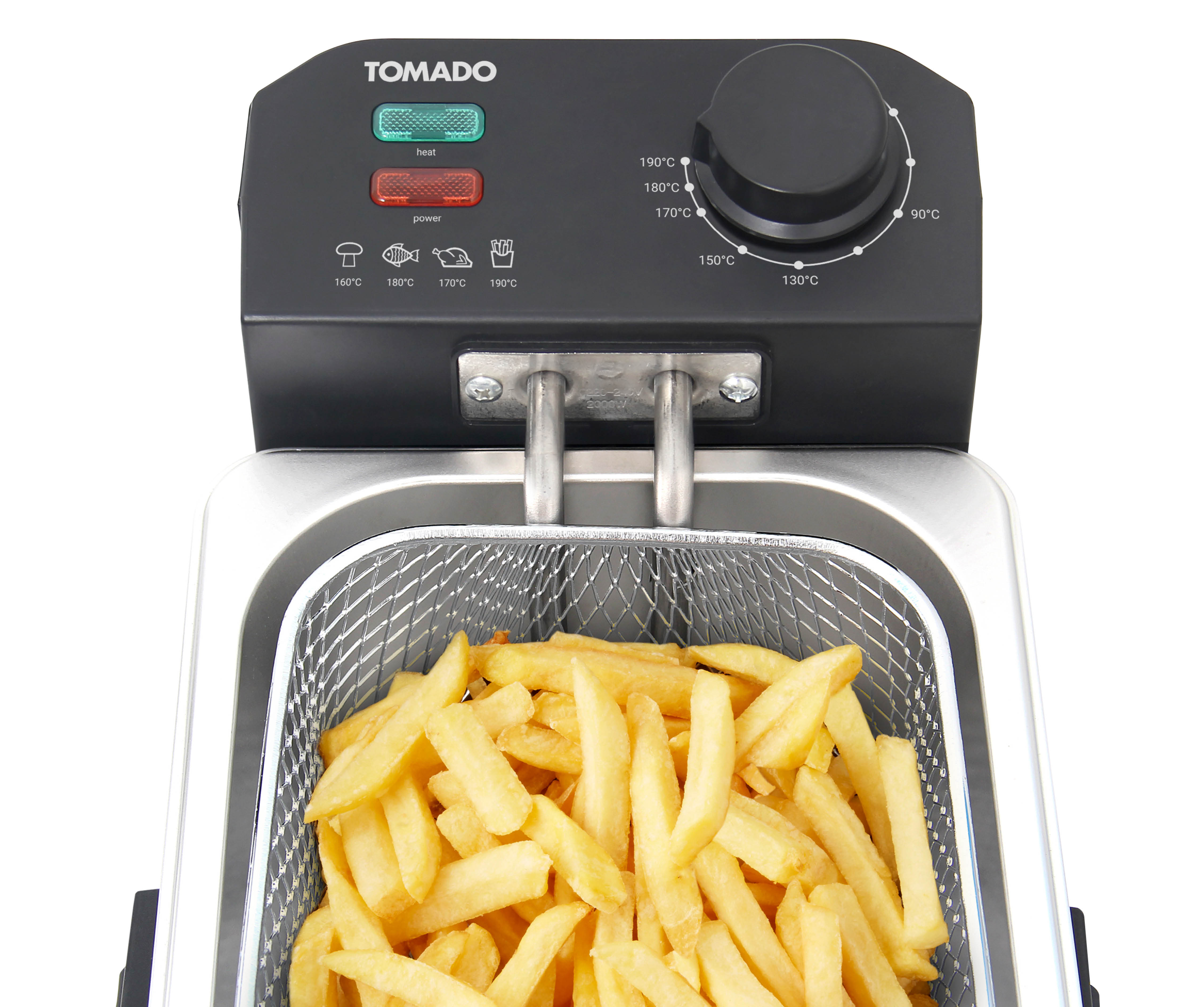 A deep fryer with a basket full of golden french fries.