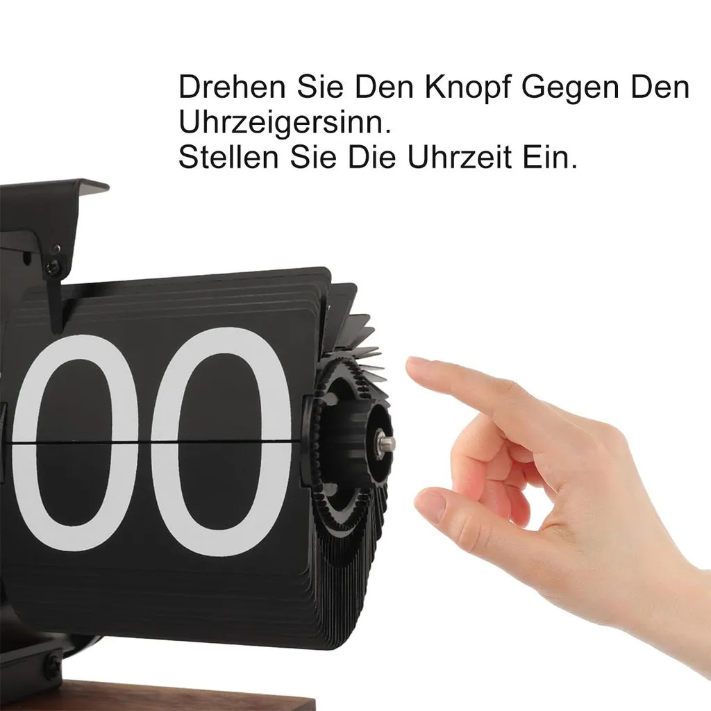 Ein Finger berührt den Knopf einer schwarzen Flip-Uhr mit der Anzeige 00.