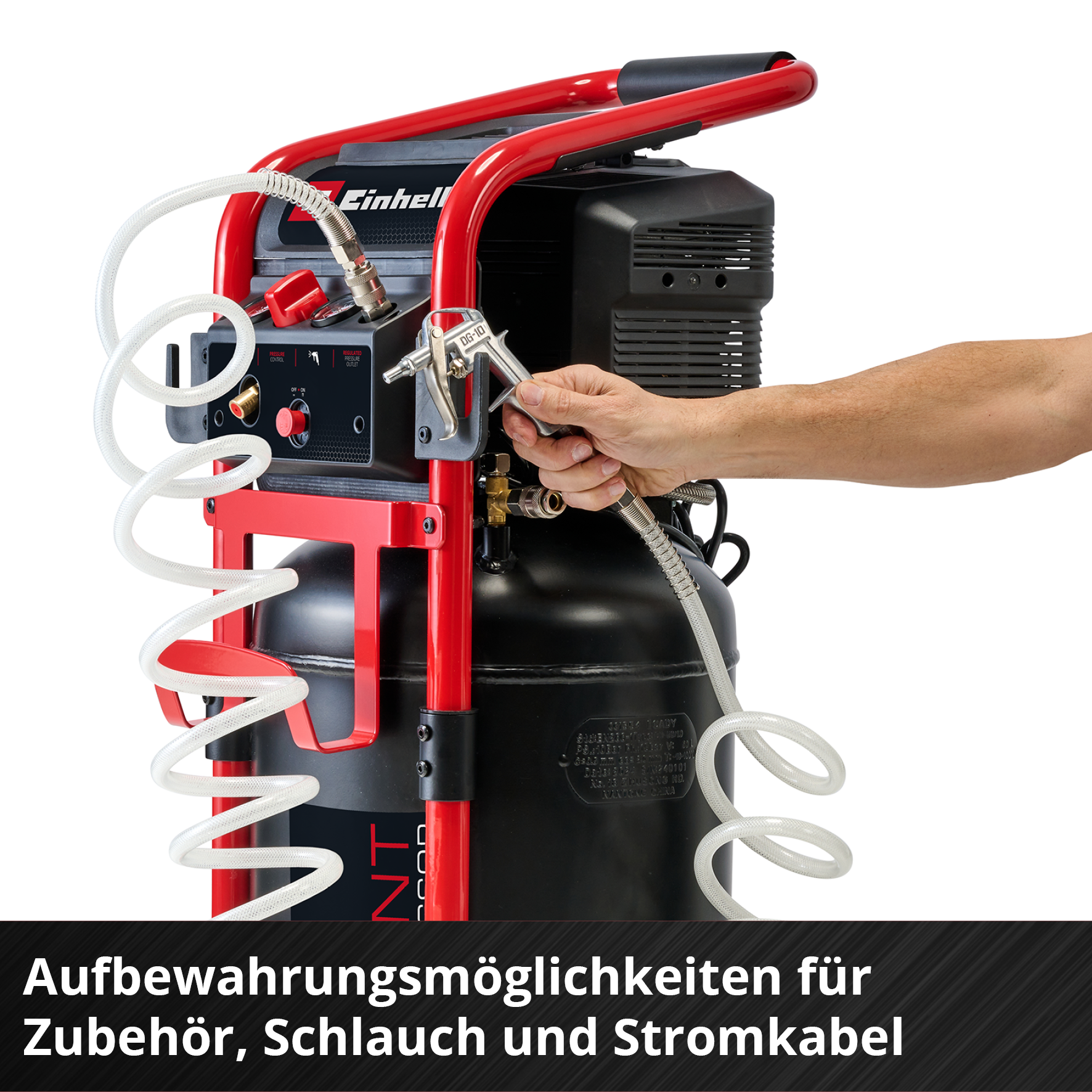 Ein Mann hält eine Druckluftpistole an einem schwarzen Kompressor mit rotem Rahmen.