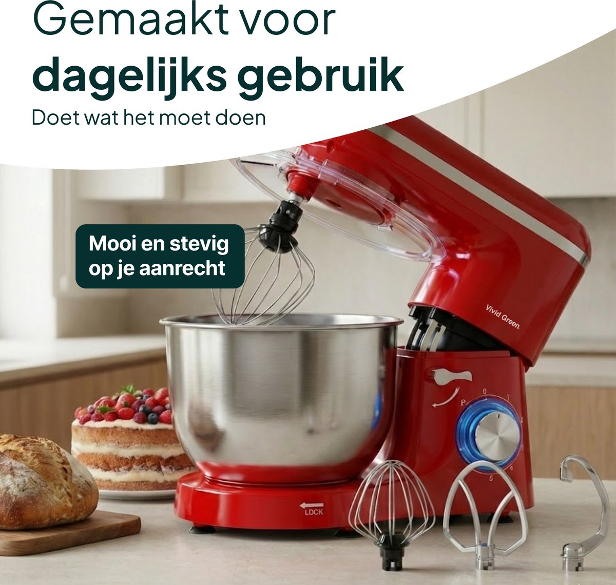 Red stand mixer with bowl, cake, bread, and accessories on a counter.