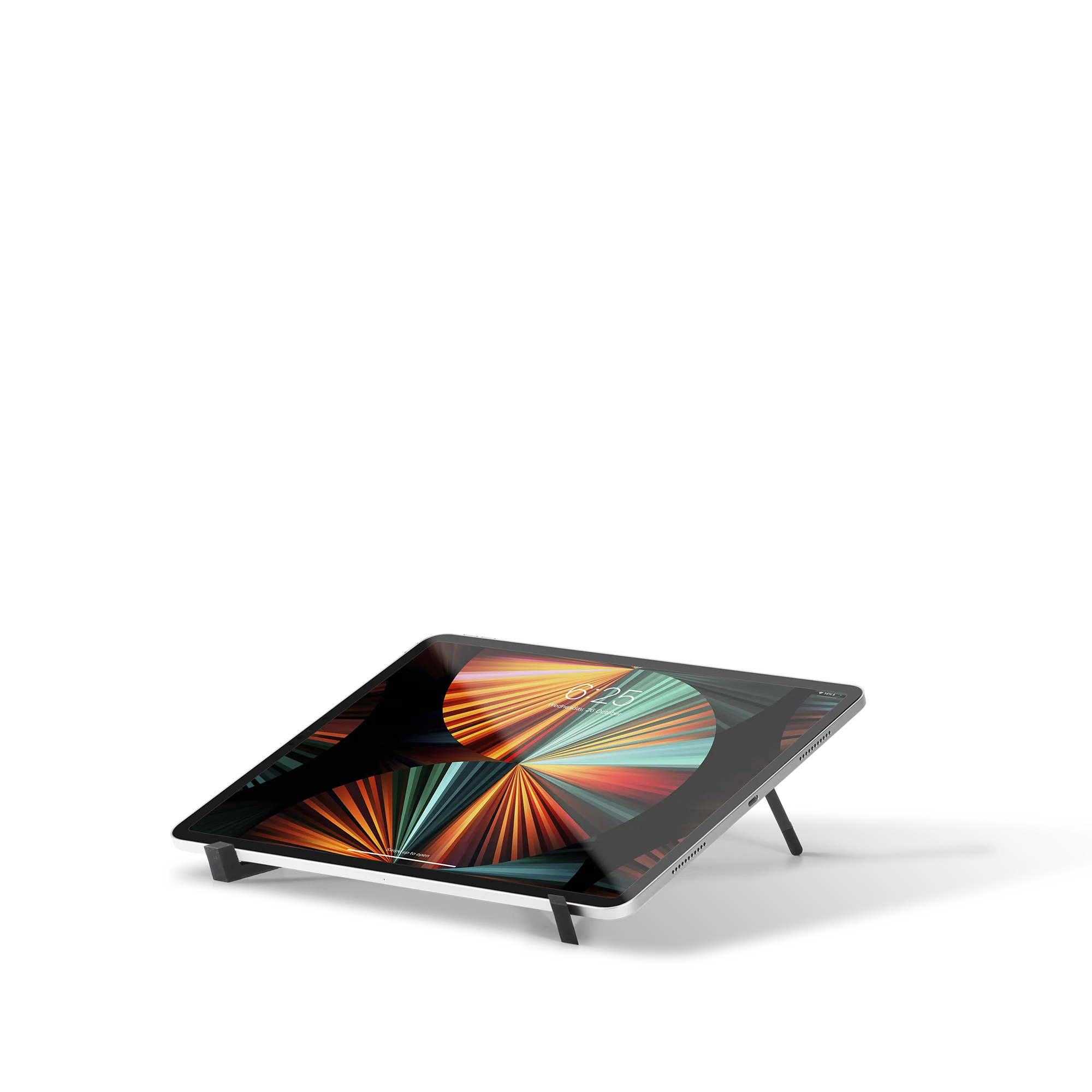 Tablet z kolorową tapetą na stojaku.