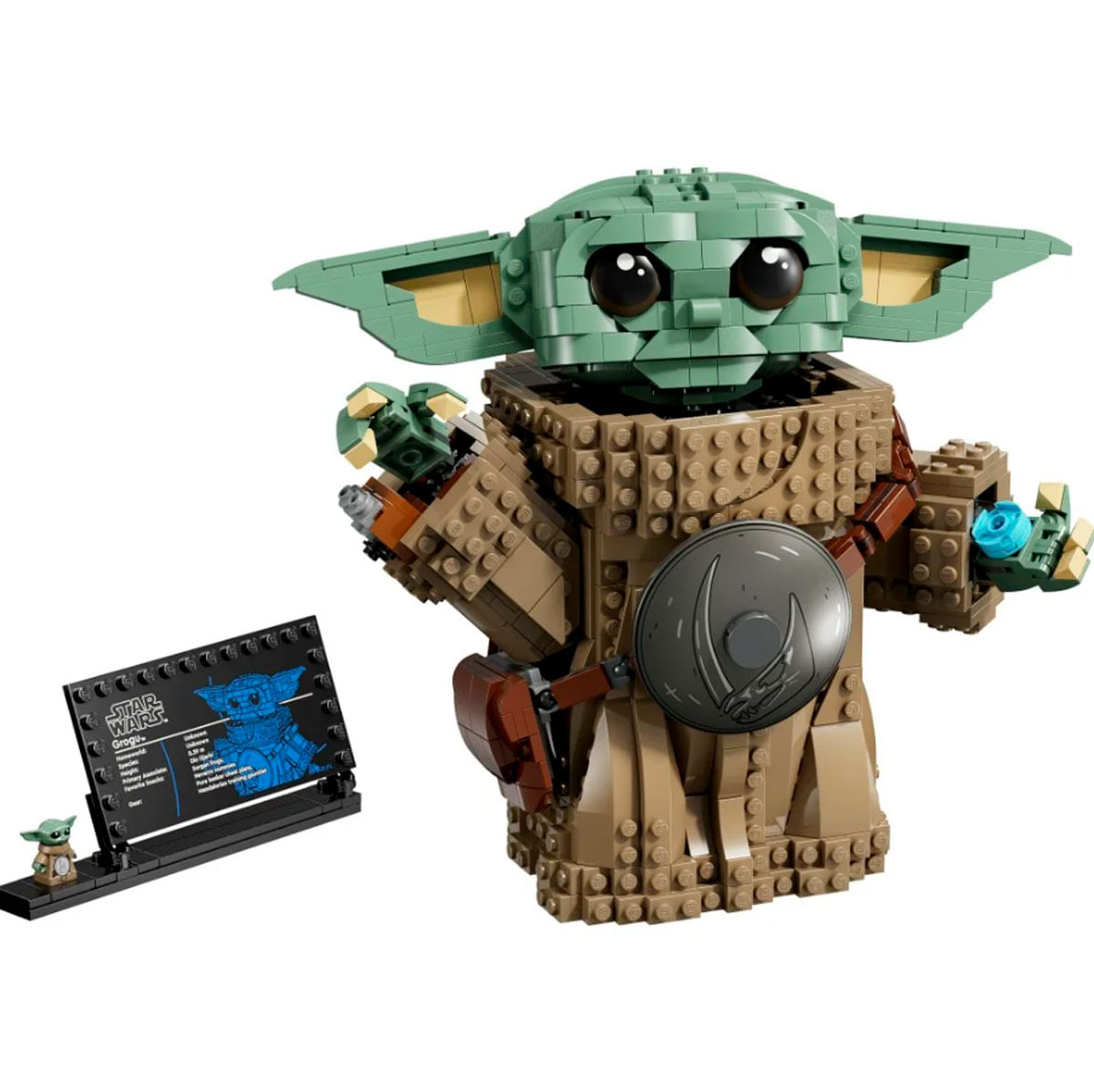 Una figura Lego di Grogu accanto a una bacheca con marchio Star Wars.